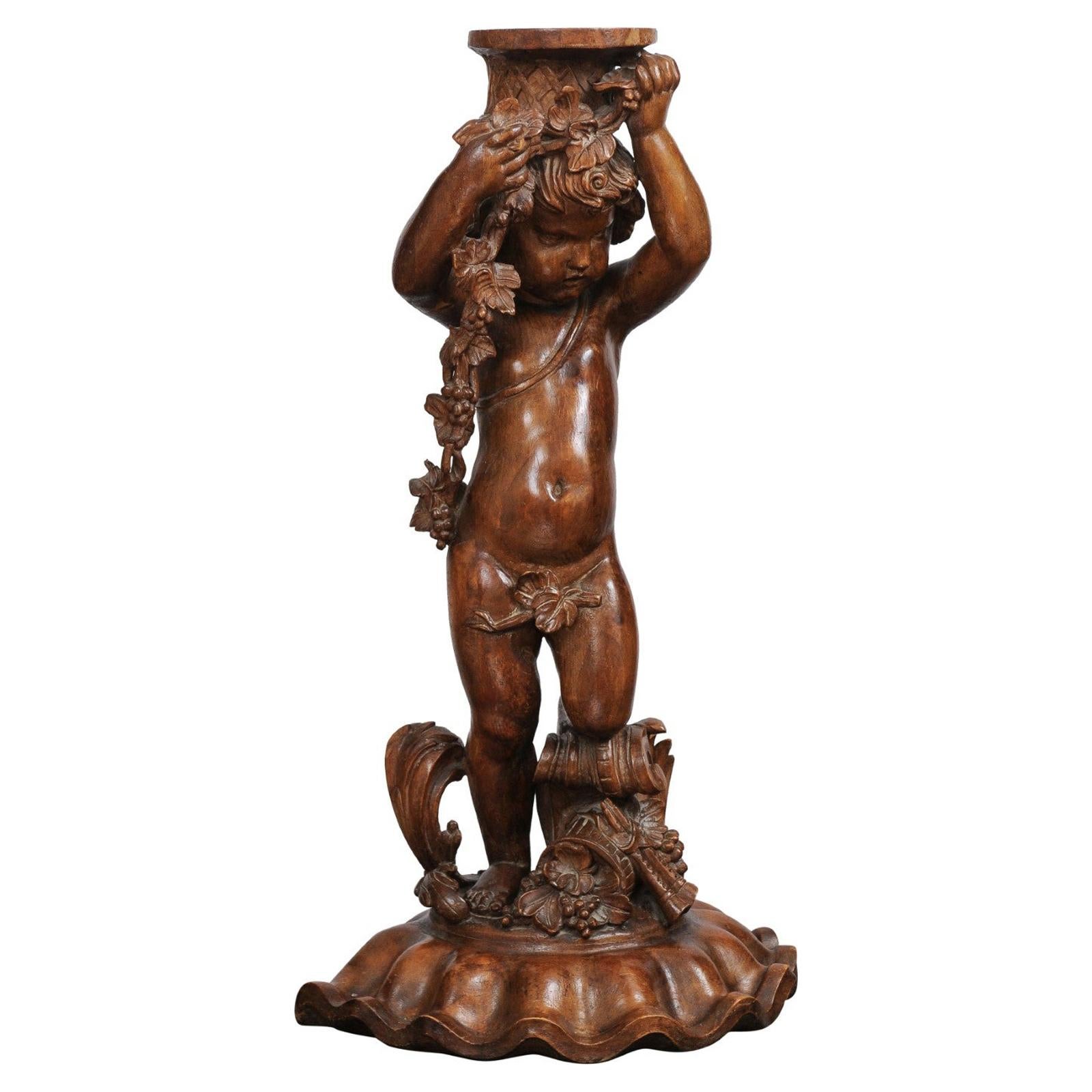 French Napoléon III 1860s Carved Walnut Sculpture of a Putto Carrying a Vessel