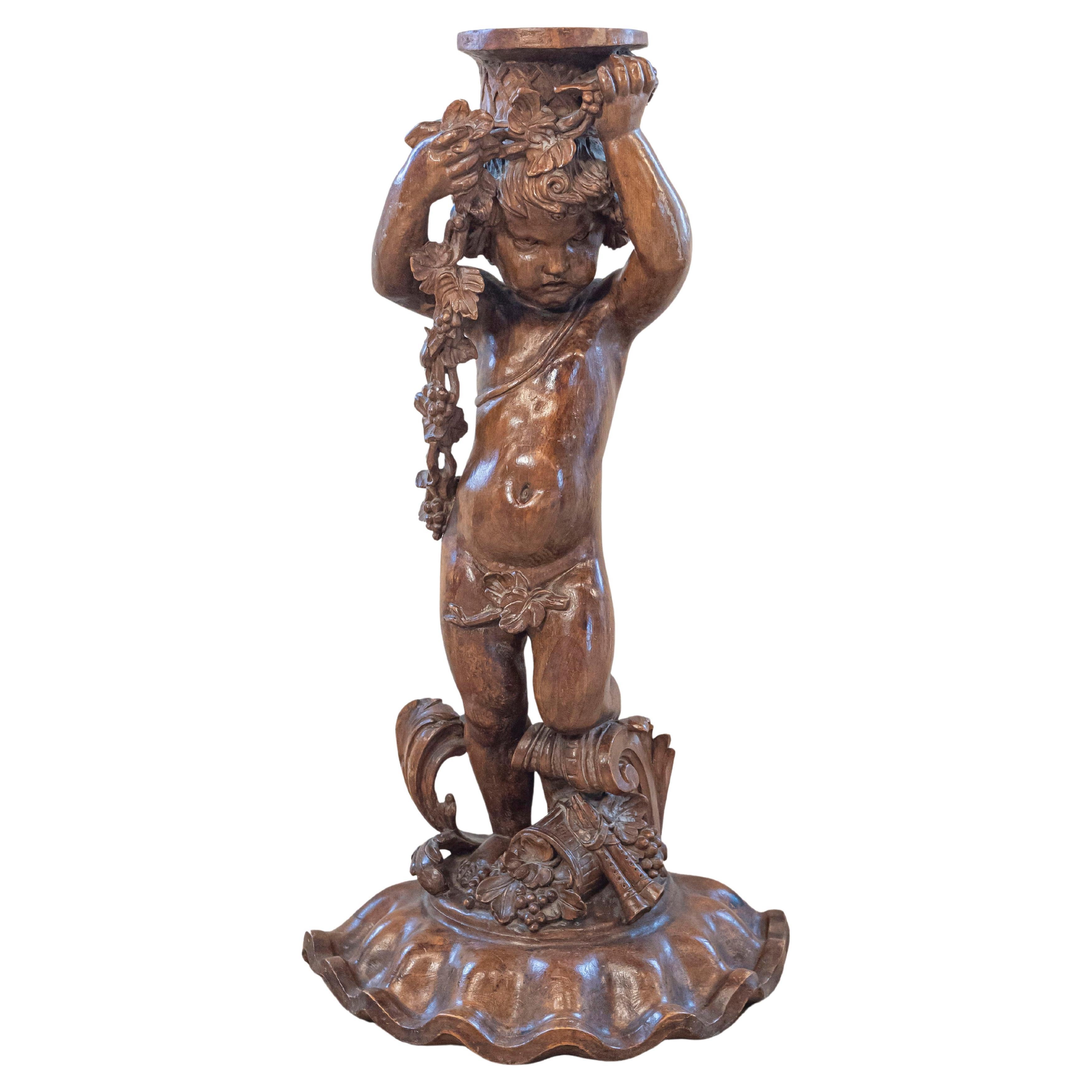 French Napoléon III 1860s Carved Walnut Sculpture of a Putto Carrying a Vessel