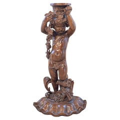 French Napoléon III 1860s Carved Walnut Sculpture of a Putto Carrying a Vessel