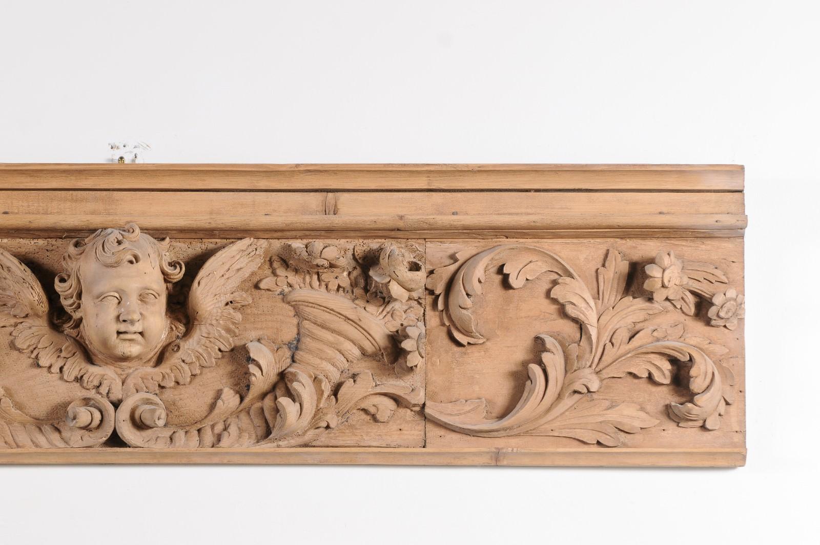 A French Napoléon III period lemon wood carved panel from the mid 19th century, with angel, cornucopia and scrolling leaves. Created in France during emperor Napoléon III's reign, this horizontal lemon wood panel depicts an angel face with wings