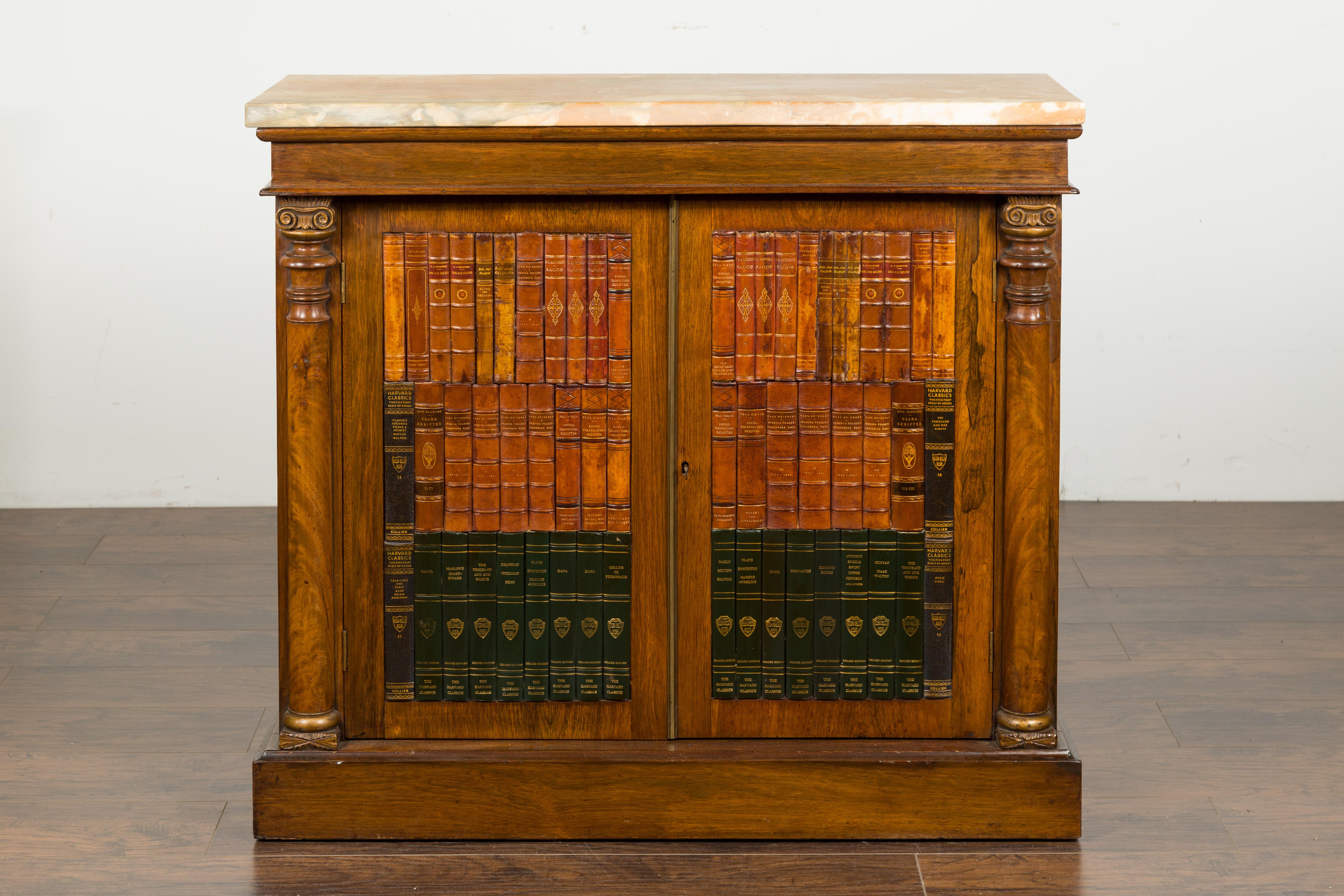 A French Napoléon III period faux book rosewood credenza from the late 19th century, with marble top and ionic columns. Created in France at the end of Emperor Napoléon III's reign, this rosewood credenza features a rectangular marble top sitting