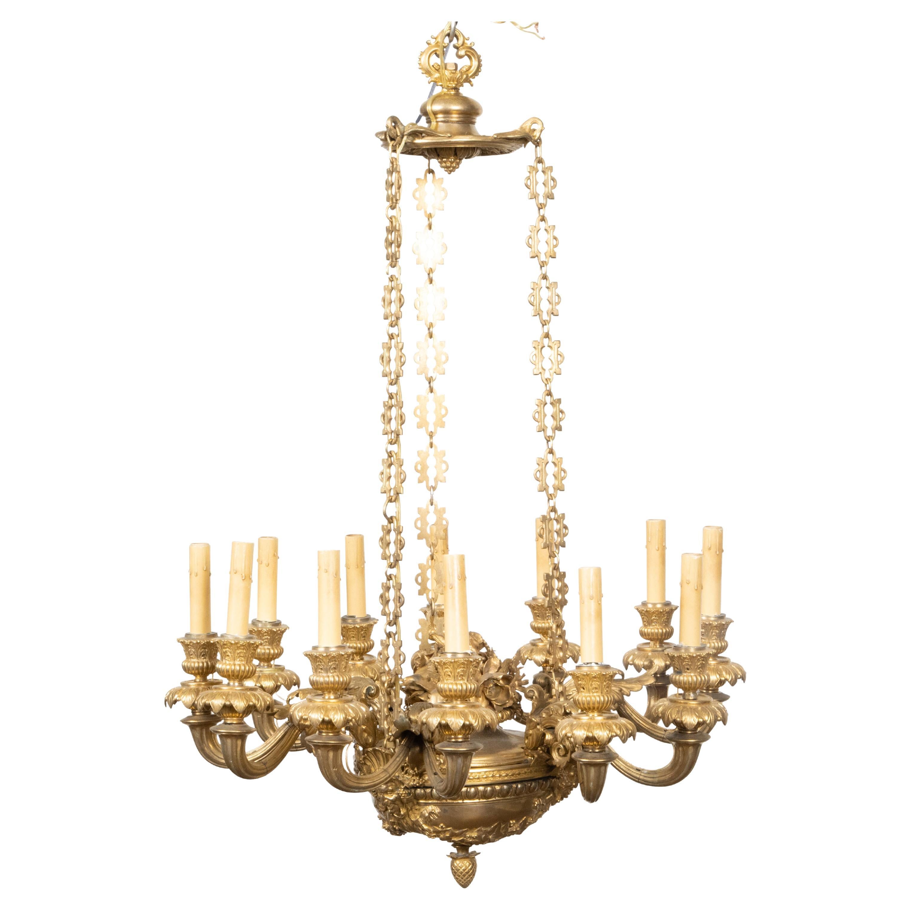 French Napoléon III 19th Century Gilt Bronze 12 Light Chandelier with Mascarons For Sale