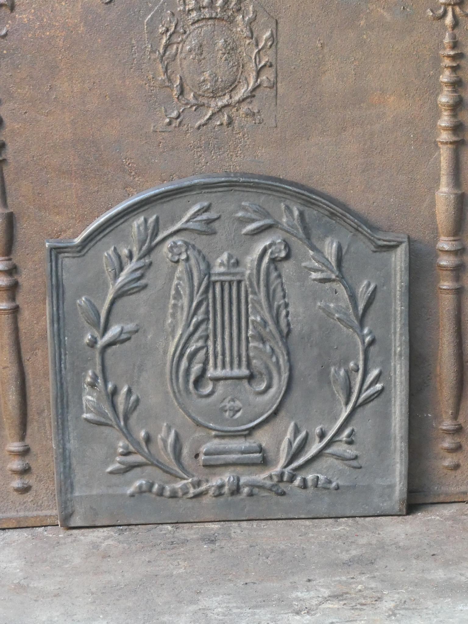 20th century French Napoleon III fireback with an allegory of music. The fireback is made of cast iron. The condition is good, no cracks.