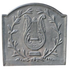 Plaque de cheminée / dosseret Napoléon III "Allégorie de la musique", 20e siècle