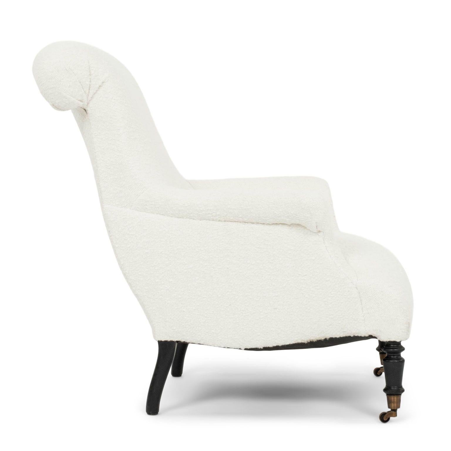Large French Napoloeon III Armchair upholstered in off-white boucle circa 1865-1884. New brass casters on front legs.

Note: Original/early finish on antique and vintage metal will include some, or all, of the following: patina, scaling, light rust,