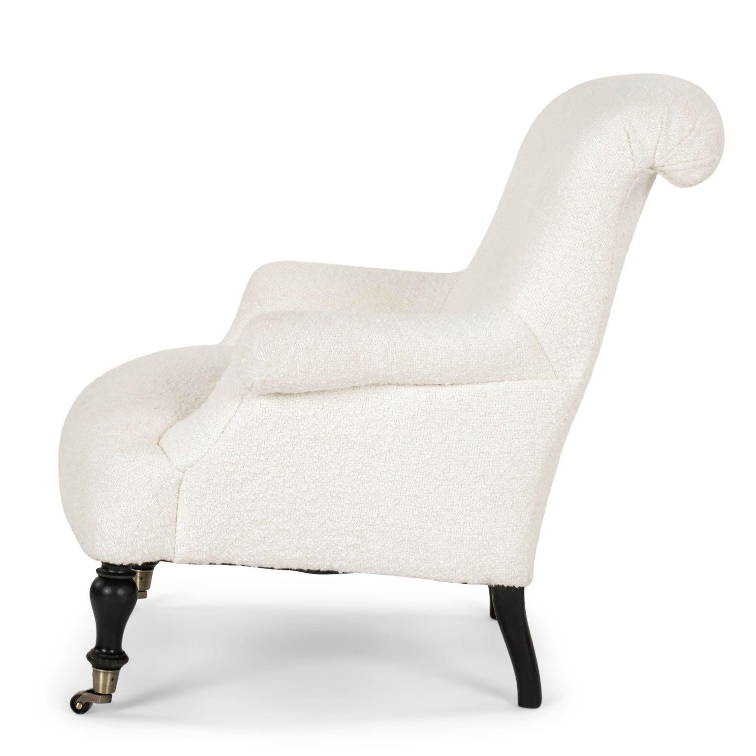French Napoleon III Armchair upholstered in off-white boucle circa 1865-1884. New casters on front legs. An excellent near-pair with a second Napoleon III chair similarly upholstered (see last two images - and item ref: 2017).

Note: Original/early