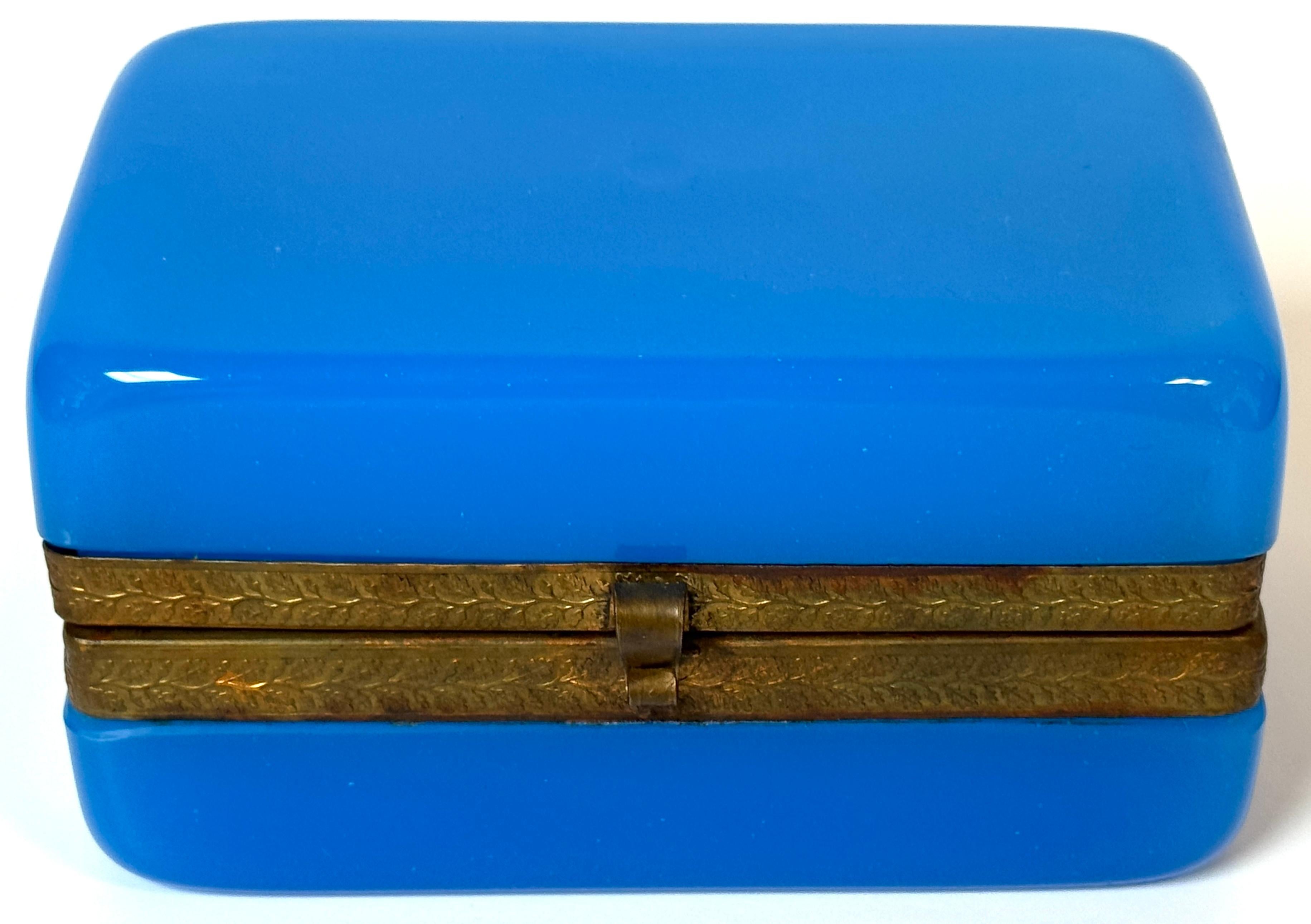 French Napoleon III Blue Opaline Glass Box with Bronze Mounts, Circa 1860

A luminous French blue opaline glass box from the Napoleon III period, circa 1860, beautifully proportioned and richly hued. Measuring 5.5 inches wide by 3.5 inches deep and