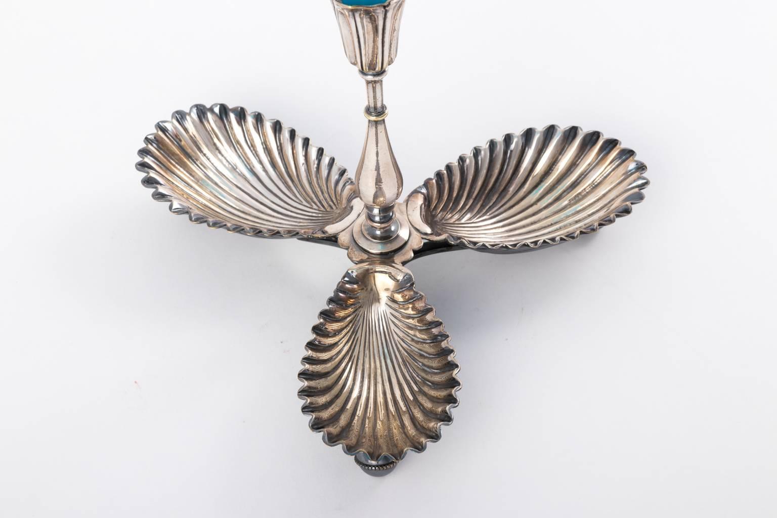 Being offered is this fabulous antique piece of elegance made from silver plate and blue Opaline glass Trumpet Epergne or vase. The center piece is faceted cut with a spider web shape on the rim and measures 4 1/2 inches wide and 5 1/3 inches tall.