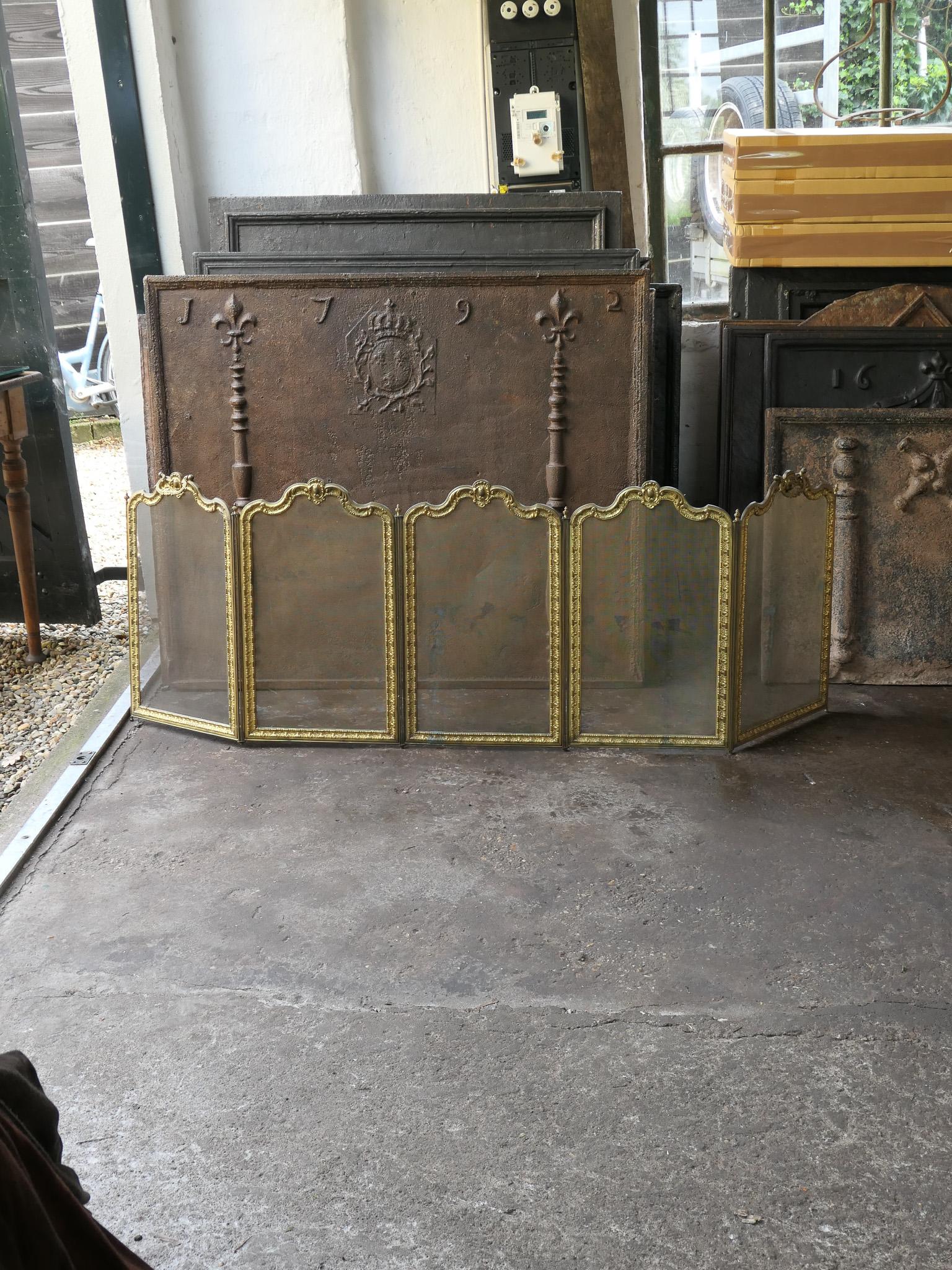 Beautiful 19th century French Napoleon III style five panel fireplace screen made by Bouhon Frères. The screen is made of brass, iron, and iron mesh. 

Bouhon Frères were prominent French producers of fireplace tools in the 19th century. The firm