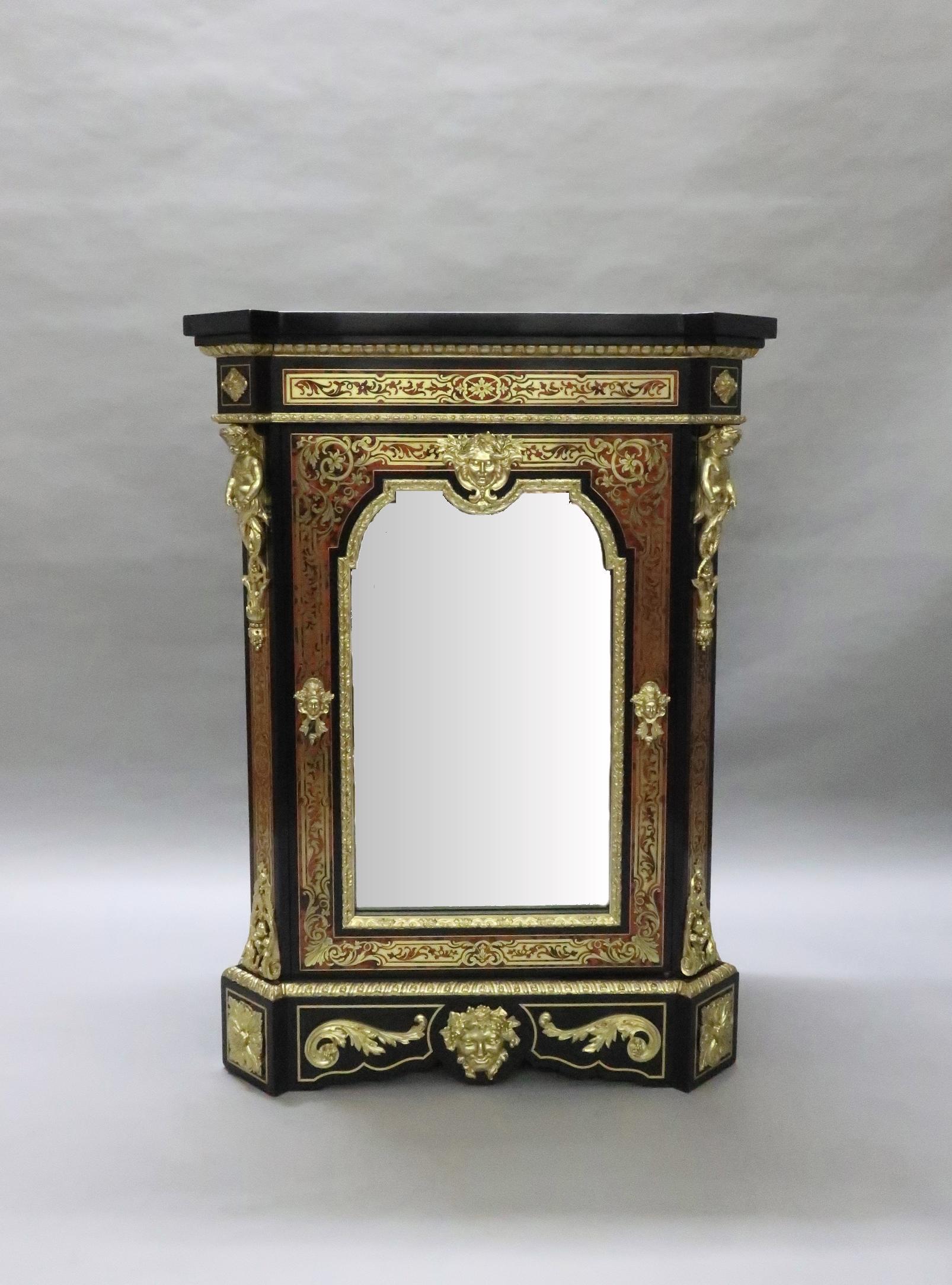 An outstanding French Napoleon III red tortoiseshell and engraved brass inlaid boulle side cabinet in the Louis XIV style by Mathieu Befort (Befort Jeune). The cabinet has scrolling floral and foliate design to the front and canted corners with