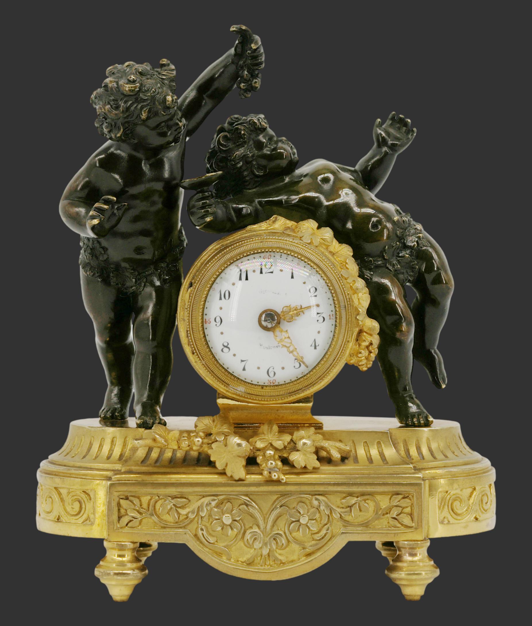 French Napoleon III bronze Bacchus putti clock, France, 1870s Height: 7.4