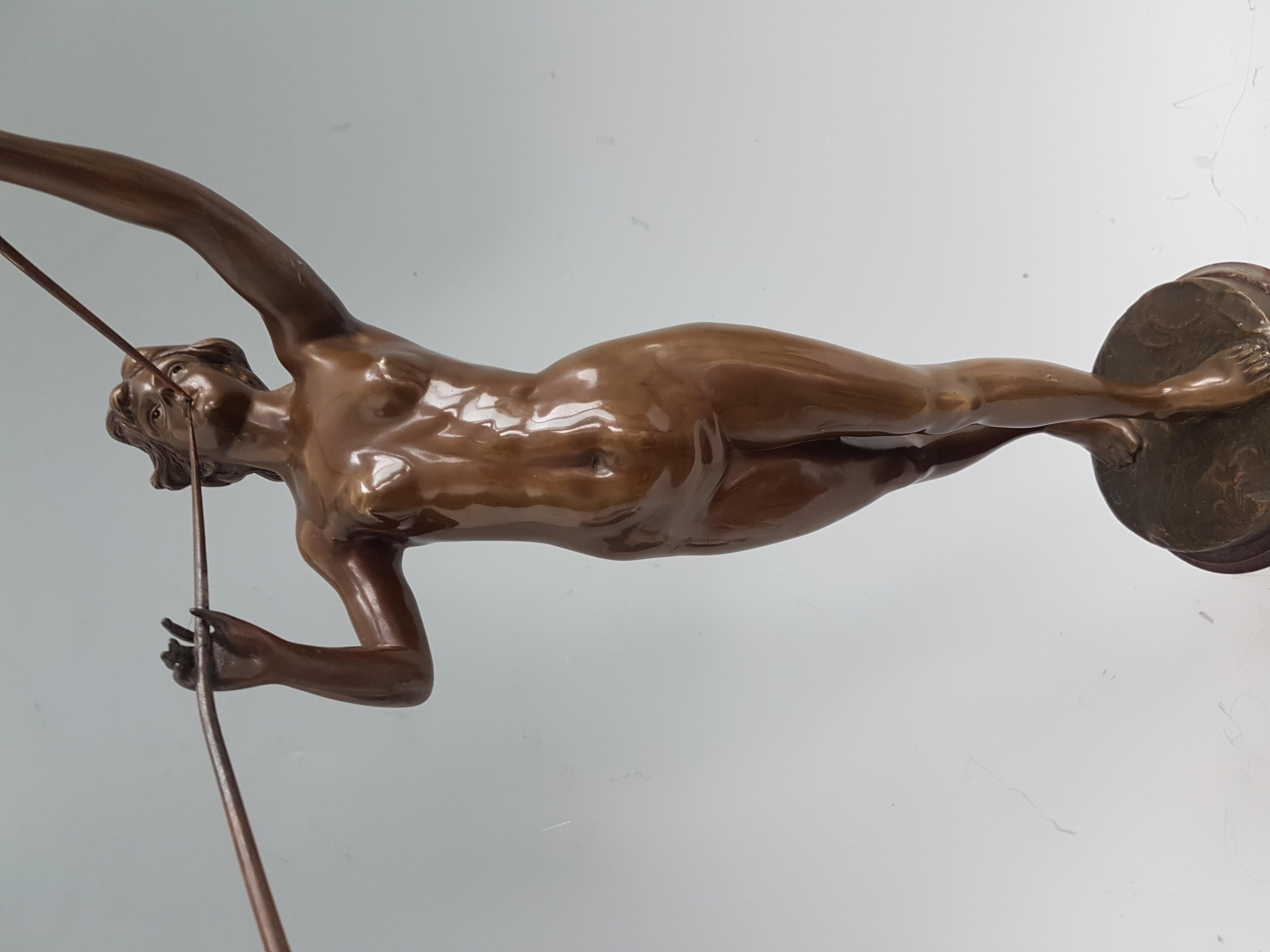 An attractive Art Nouveau bronze of a young nymph blowing two trumpets. Set on an attractive, shaped rouge marble base. Excellent color and patination.