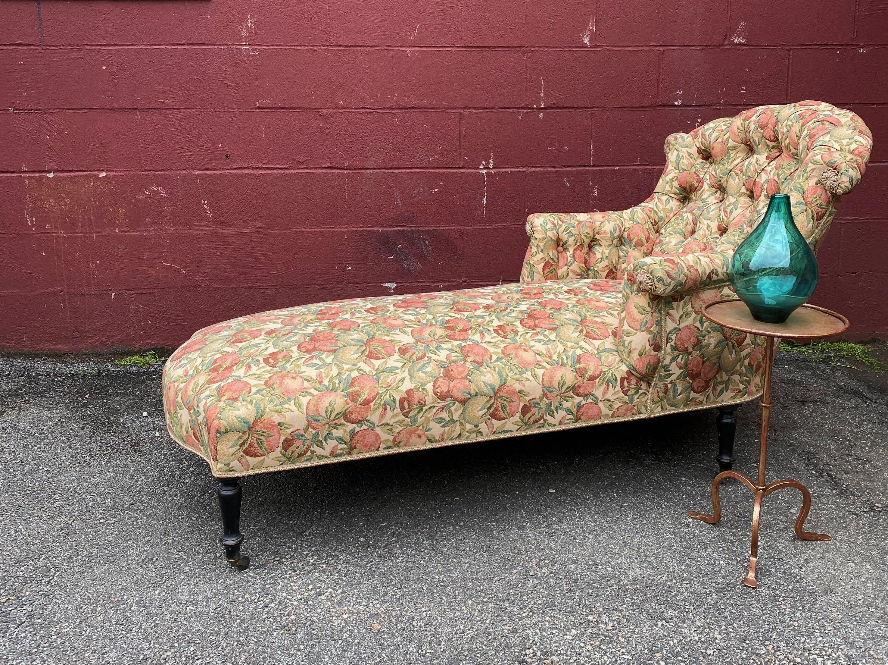 19th century chaise lounge that has been upholstered in a multicolored patterned fabric. The inside back and arms are tufted. While the fabric is not new it is good condition and can be used as is. 

French circa 1880. Sold as is.

 