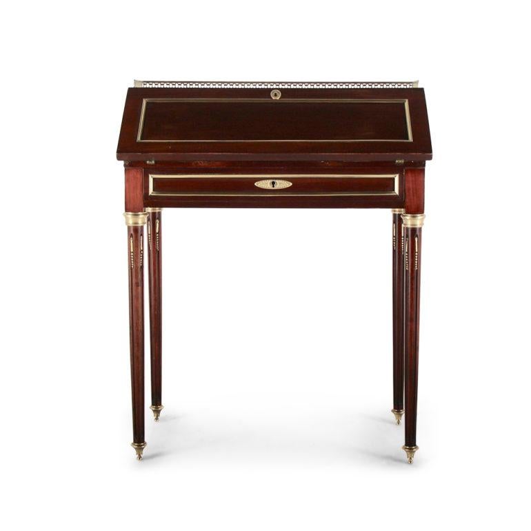 A French ‘Napoleon III’ drop-front desk, the small upper desk opening to reveal fitted drawers and a writing surface, and raised on turned tapering legs with inset brass fluting, circa 1880.



 