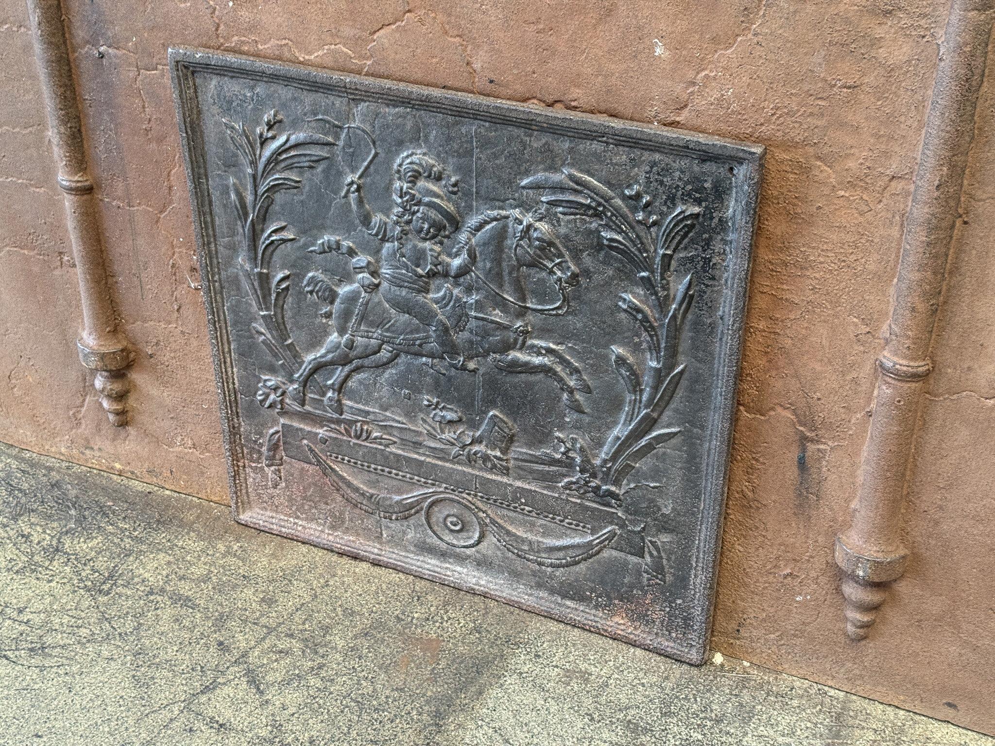 19th century French fireback with a boy on a horse. Napoleon III Period. 

The fireback is made of cast iron and has a natural brown patina. Upon request, it can be made black / pewter. The condition is good, no cracks.