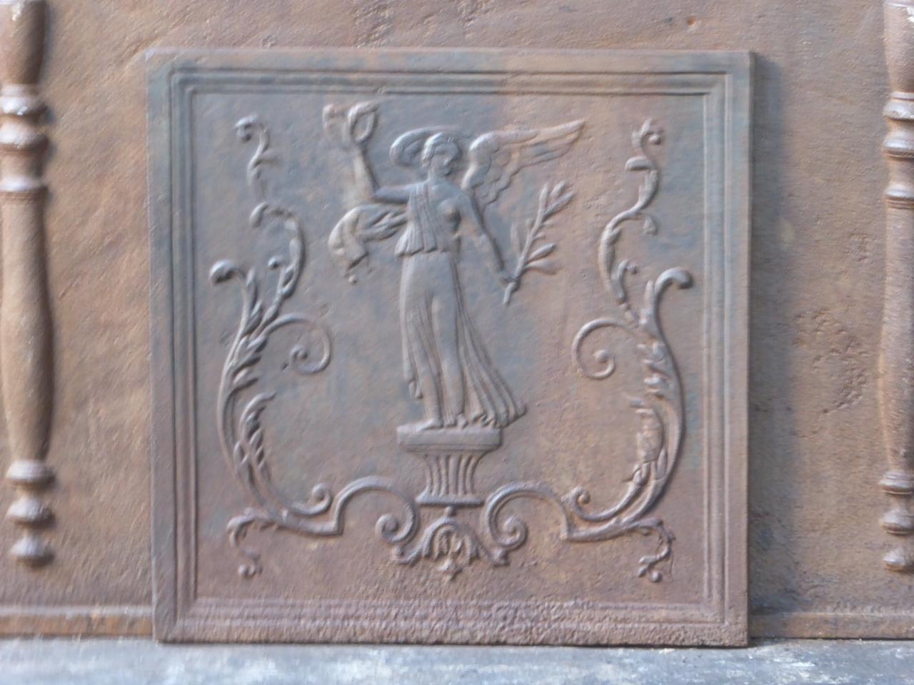 19th century French Napoleon III fireback with an allegory of Peace. The Allegory of Peace is holding an olive branch, symbol for peace and a laurel wreath, symbol for victory, in her hands.

We have a unique and specialized collection of antique