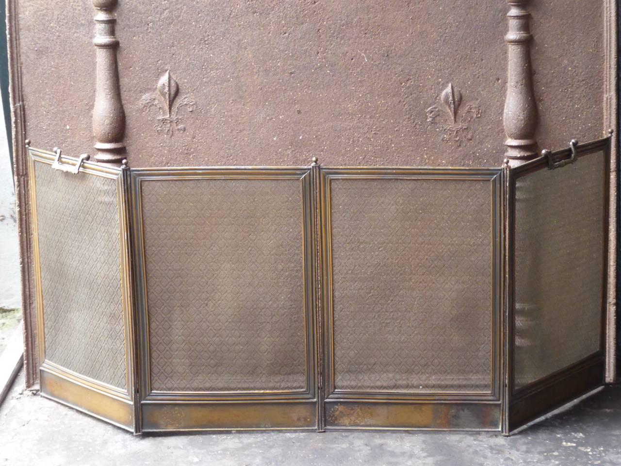 French Napoleon III fireplace screen made of brass, iron and iron mesh.

We have a unique and specialized collection of antique and used fireplace accessories consisting of more than 1000 listings at 1stdibs. Amongst others, we always have 300+