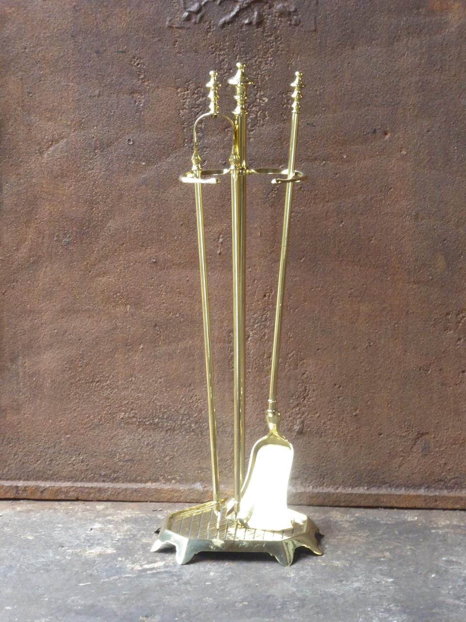 Early 20th century French Napoleon III fireplace tool set. The fire irons consist of a stand and two fireplace tools. They are made of polished brass. The fire tools are in a good condition and are fully functional.

We have a unique and specialized