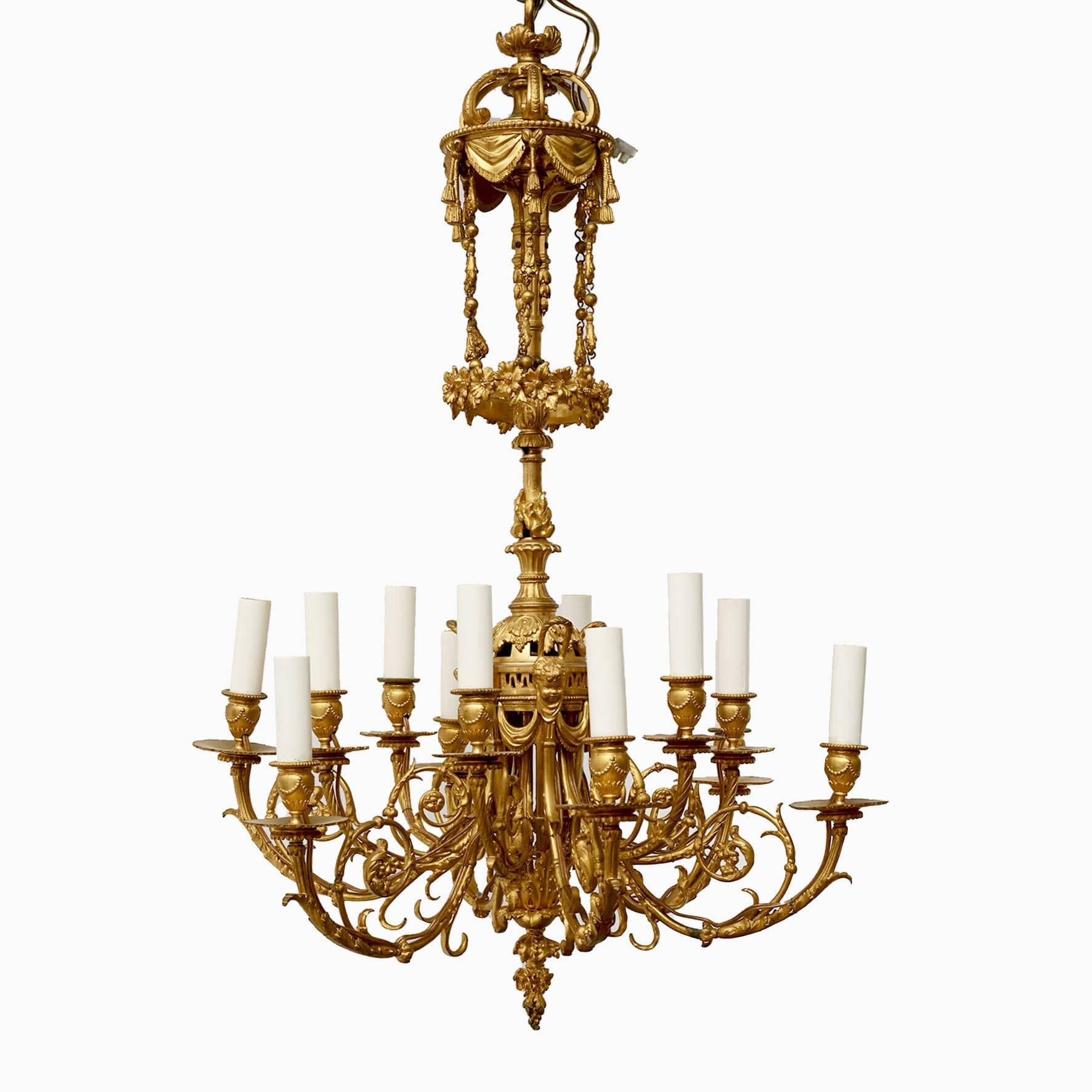 French chandelier in gilded bronze.
12 Candle pipes richly decorated. At the top with canopy under chains with foliage and flowers.
Arms with leaf work finished with putti heads and several fine details.
France 1860-1870.