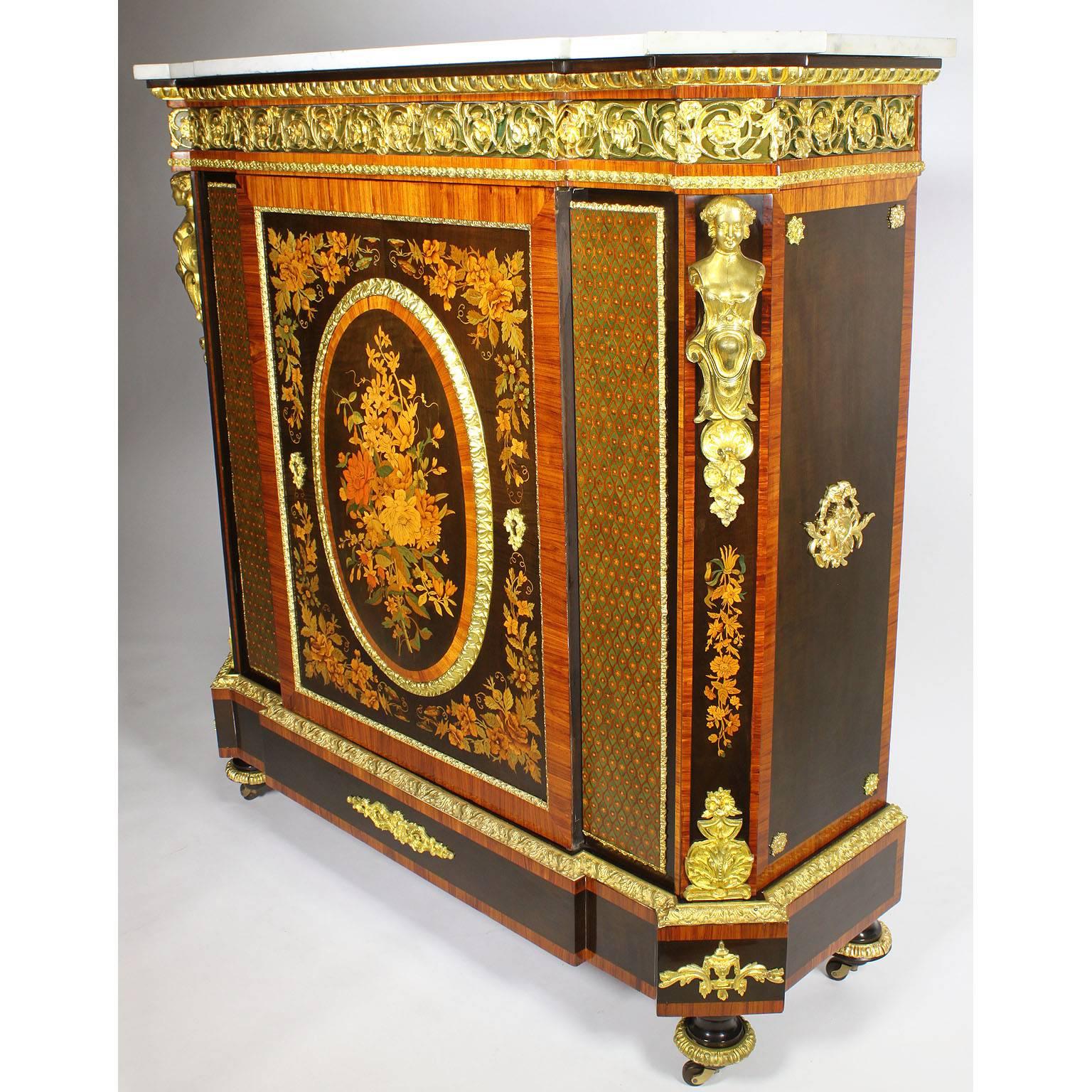 A very fine French Napoleon III gilt bronze mounted and marquetry meuble d'appui à hauteur (Side cabinet). The rectangular variegated white marble top with outset corners over a gilt foliate scroll mounted frieze above a door centering an oval leaf