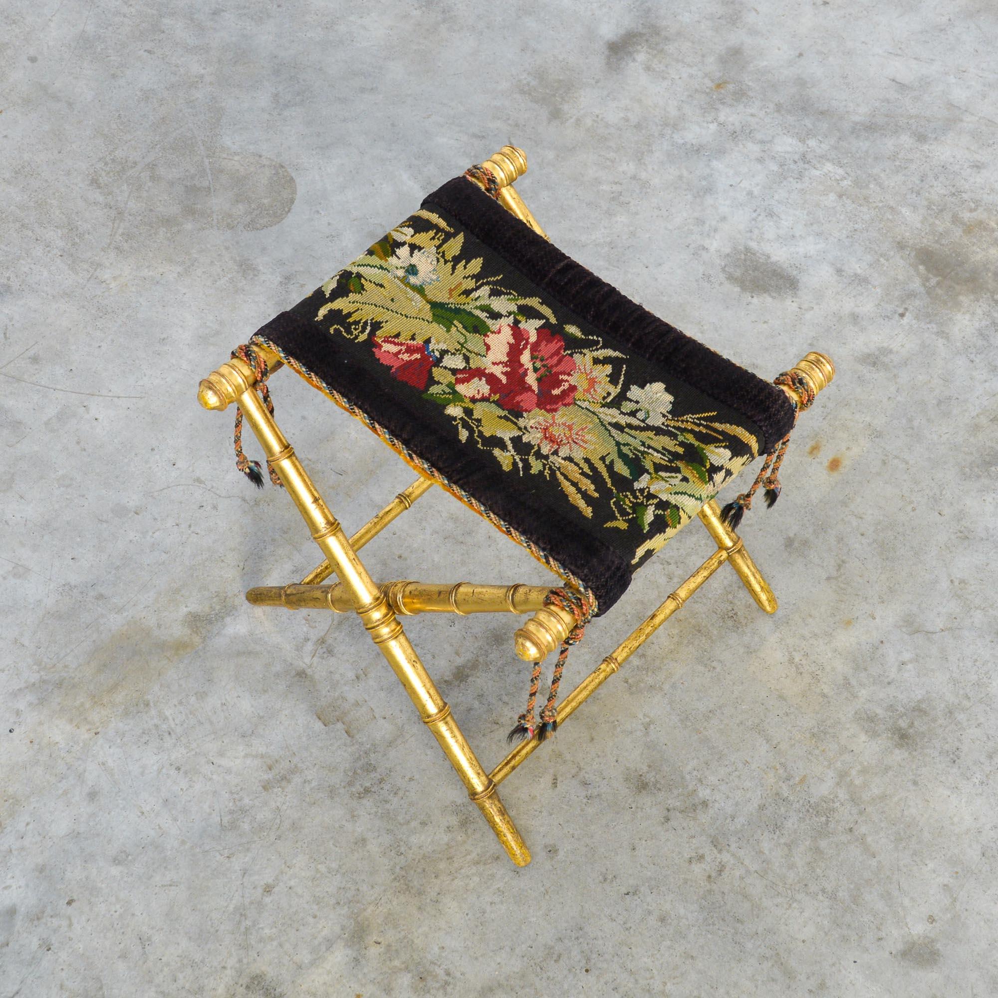 Love at first sight!
This decorative Napoleon III folding stool dates from circa 1850.
It is an elegant low stool with a gilt wooden faux bamboo folding base. The seat still has its authentic embroidery finished with velvet.
This extraordinary