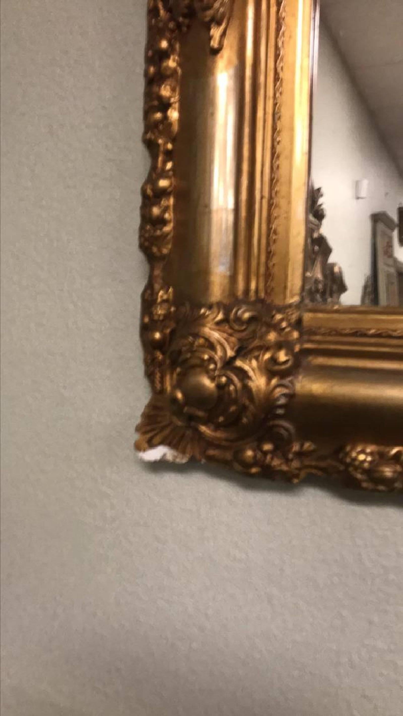 Outstanding 19th century French Napoleon III giltwood and gesso wall mirror with a carved lovebird and leaf scroll pediment. The borders carved in an acanthus leaf and festoon motif,

circa 1890

Slight chipping to gesso on bottom left corner as