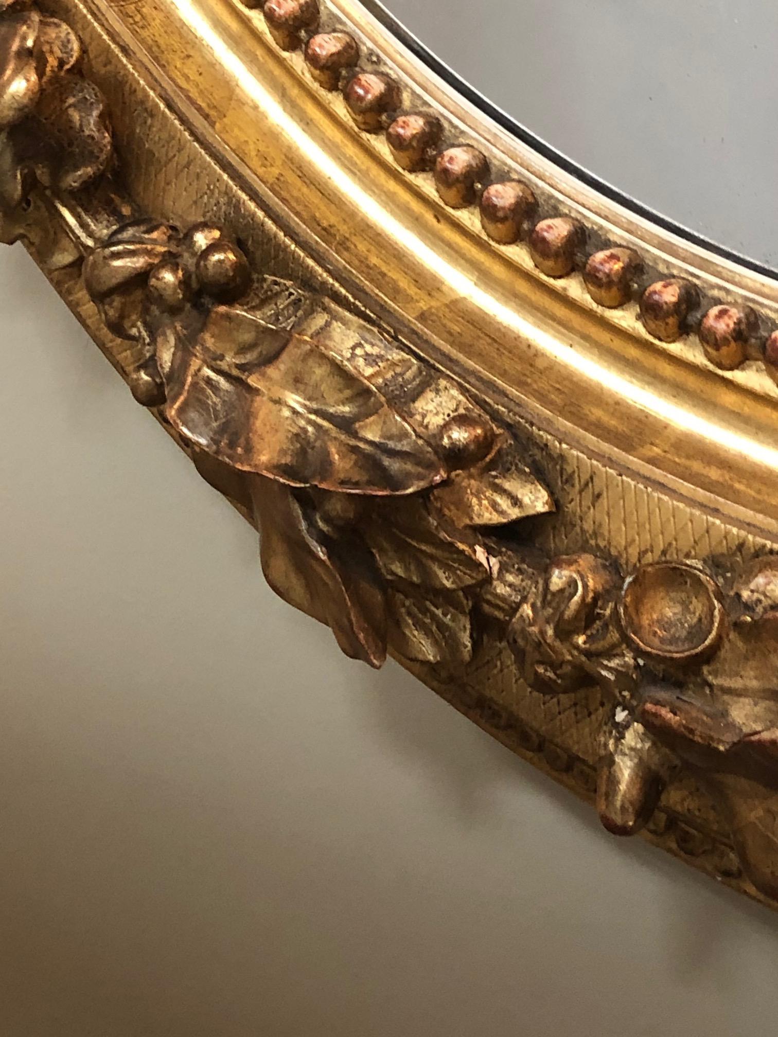 19th Century French Napoleon III Giltwood and Composite Oval Mirror with Ribbon Crest