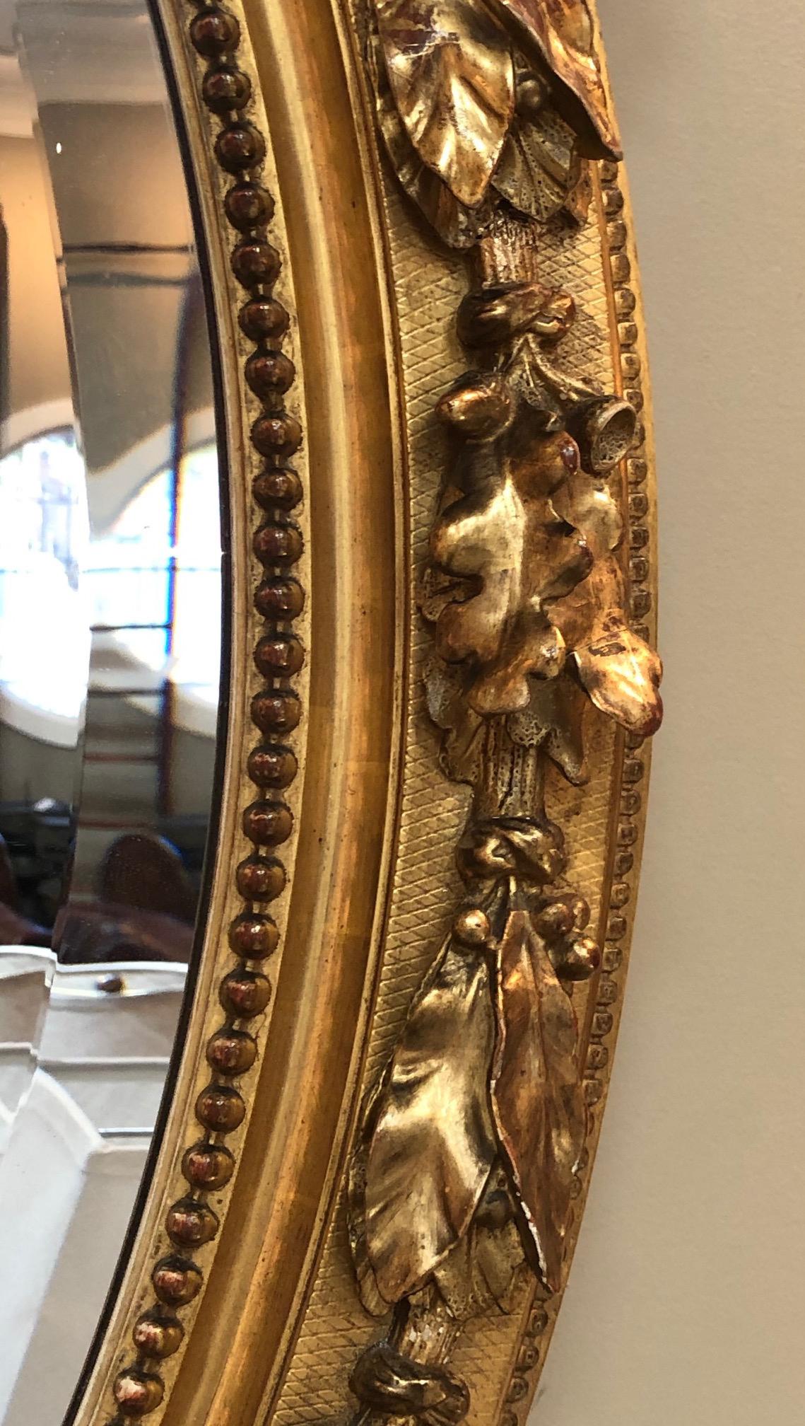 Wood French Napoleon III Giltwood and Composite Oval Mirror with Ribbon Crest For Sale