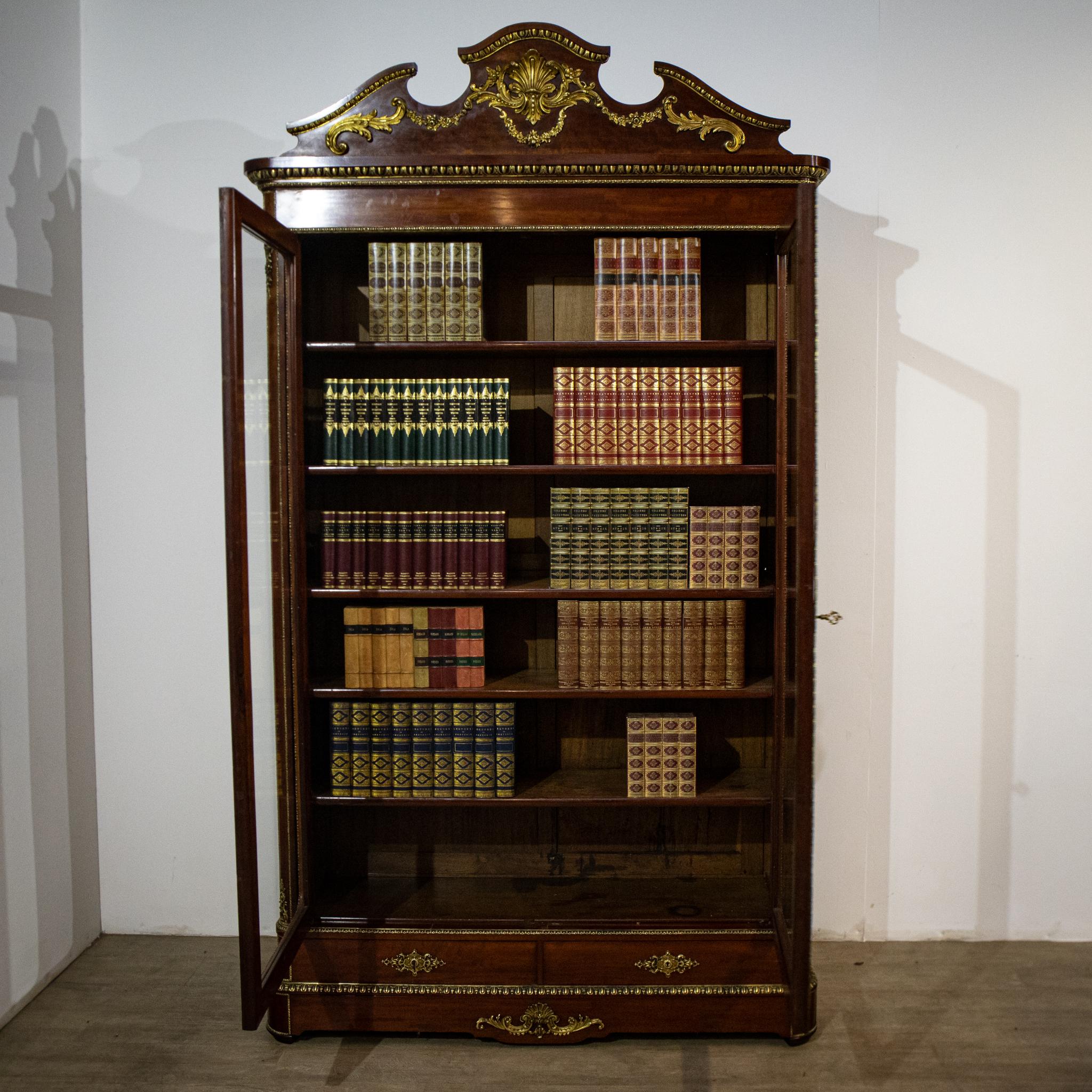 A magnificent 19th century glazed bookcase from the period of Napoleon III, this piece is of exceptional quality. In line with French practice of the time, it is designed to be dismantled to allow easy transport and installation. With five
