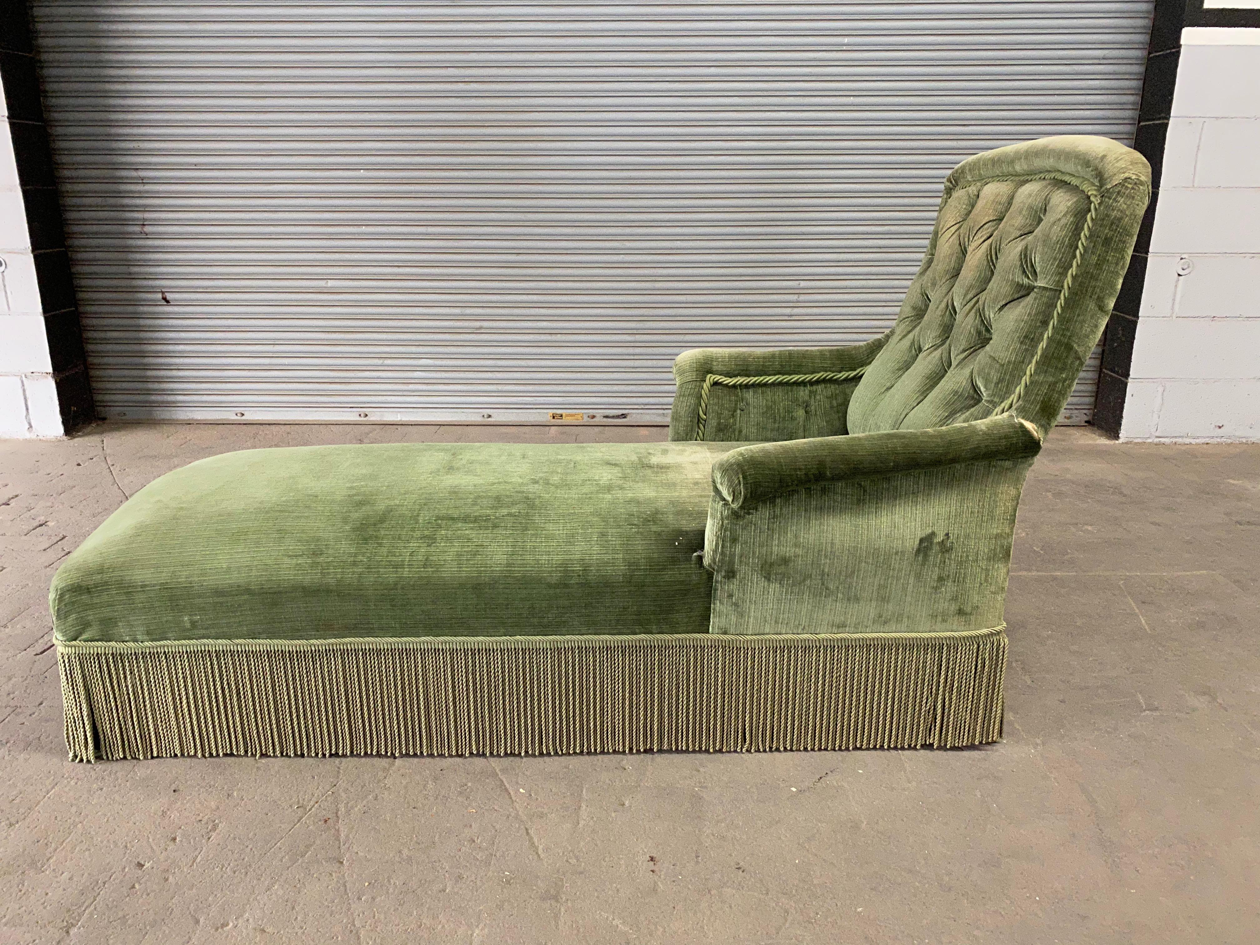 Classic 19th century French chaise longue with tufted back and fringe detail. Upholstery has wear and tear but structurally, this chaise is in  good condition.

This piece is sold as is.  
