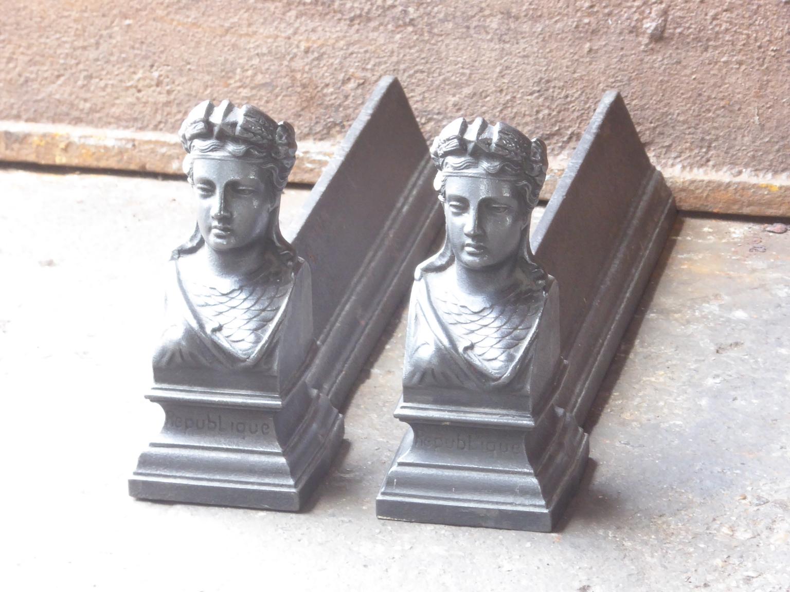 19th century French Napoleon III andirons made of cast iron. Marianne is one of the most prominent symbols of the French Republic, and is officially used on most government documents. Her profile stands out on the official government logo of the