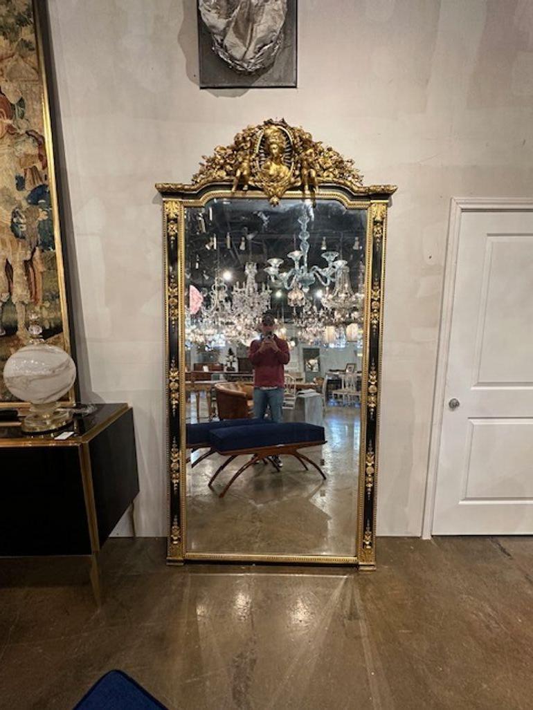 Exceptional 19th century French Napoleon III carved and parcel gilt floor mirror. Circa 1880. A timeless and classic touch for a fine interior.