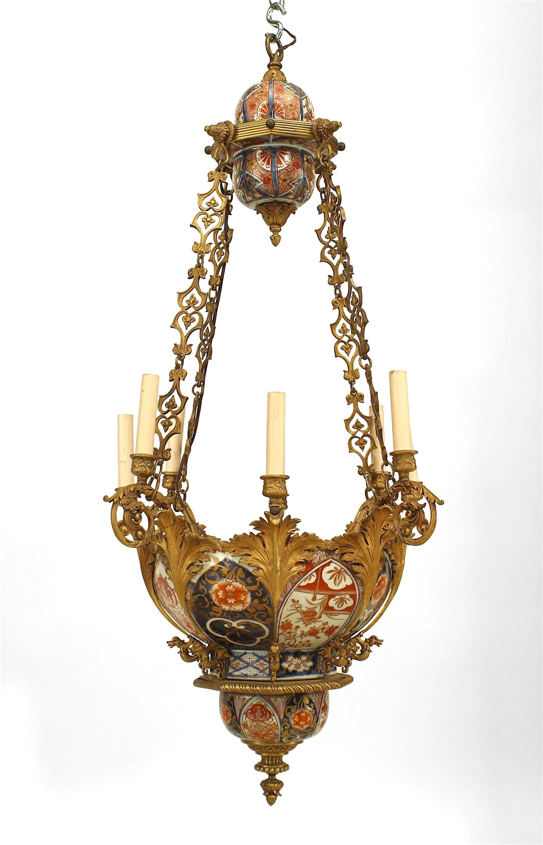 French Napoleon III (19th Century) chandelier with red, white and blue Imari porcelain bowl and top section with bronze dore 8 foliate form arms suspended on a stylized filigree chain.
 