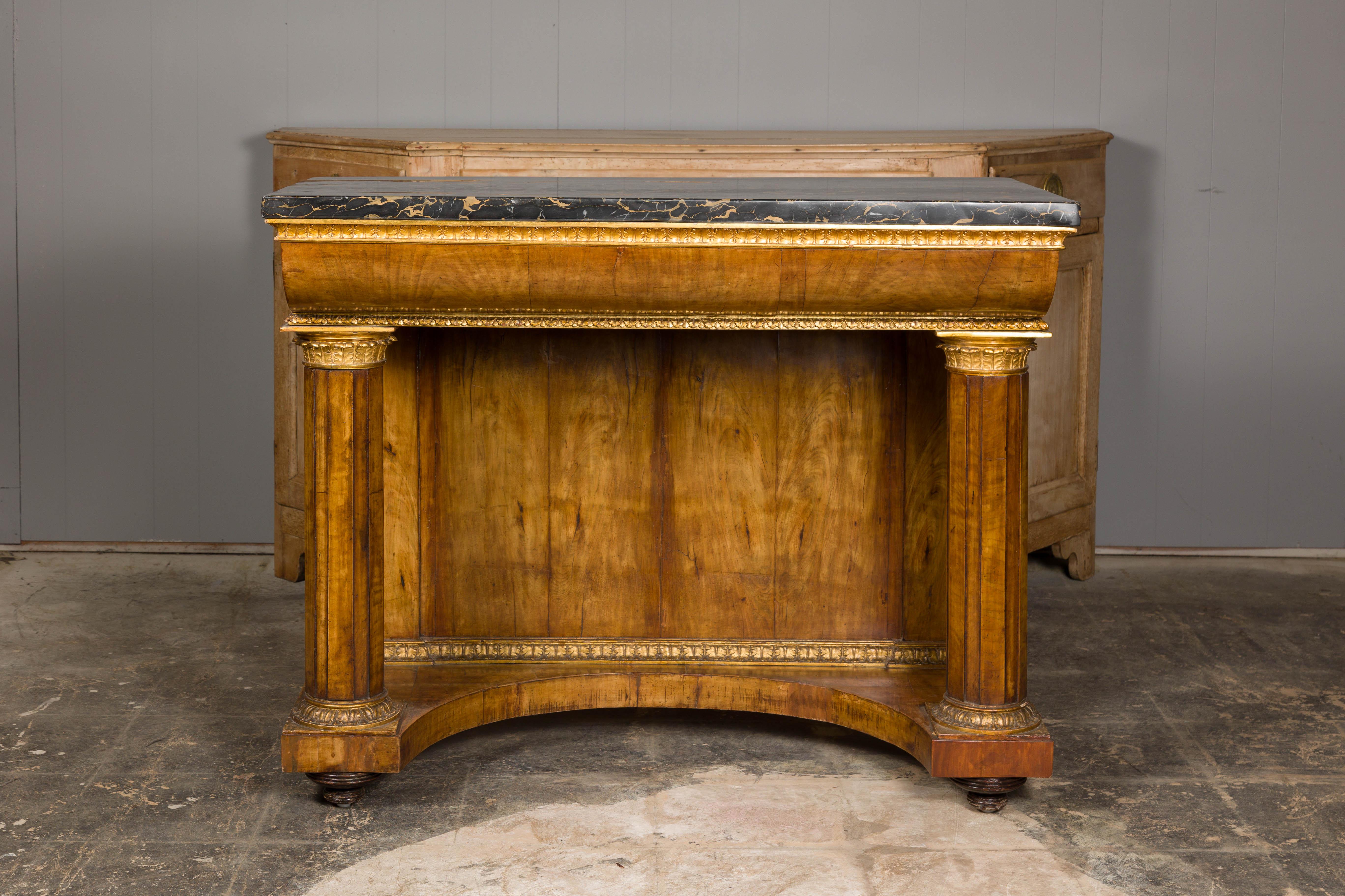 A French Napoléon III period walnut console table from circa 1860 with original marble top and carved gilt accents. This French Napoléon III period console table, dating back to around 1860, is a masterpiece of timeless elegance and intricate