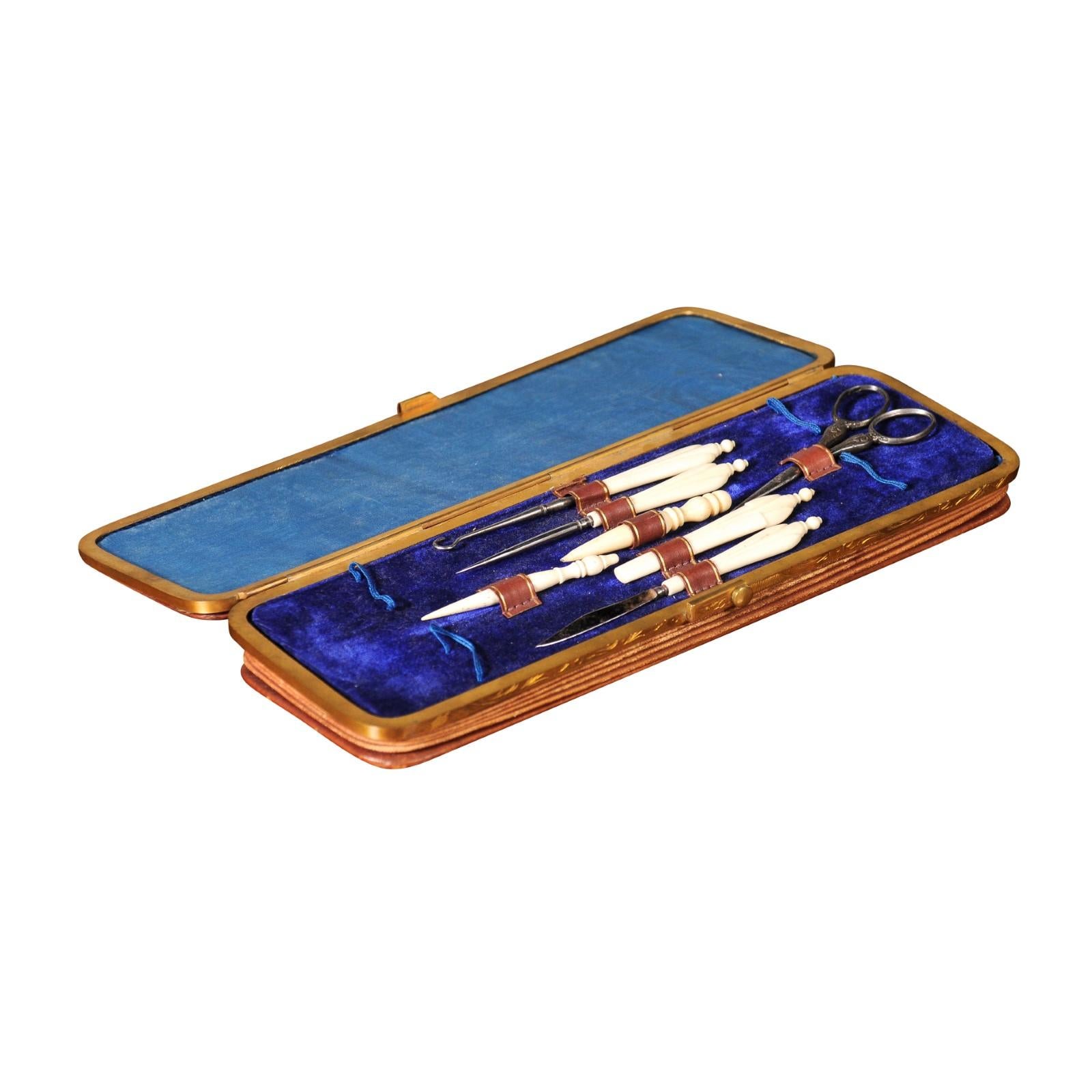 French 1850s Napoléon III period leather case sewing kit with bronze hardware and blue velvet interior. Take a step back into the lavish world of the mid-19th century with this French Napoleon III period sewing kit. This exquisite sewing kit exudes