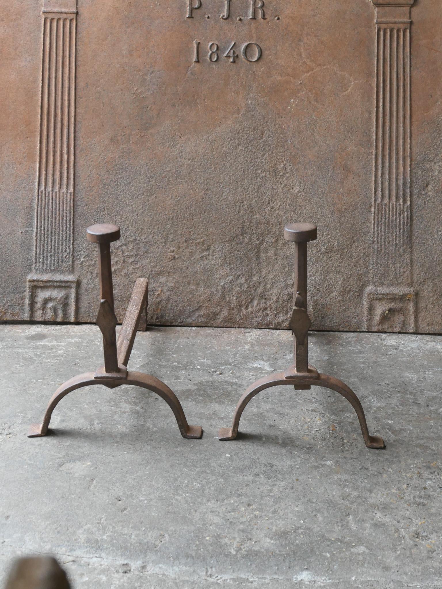 Large 19th century French Napoleon III Period andirons. The andirons are made of wrought iron. They have spit hooks to grill food. The condition is good.