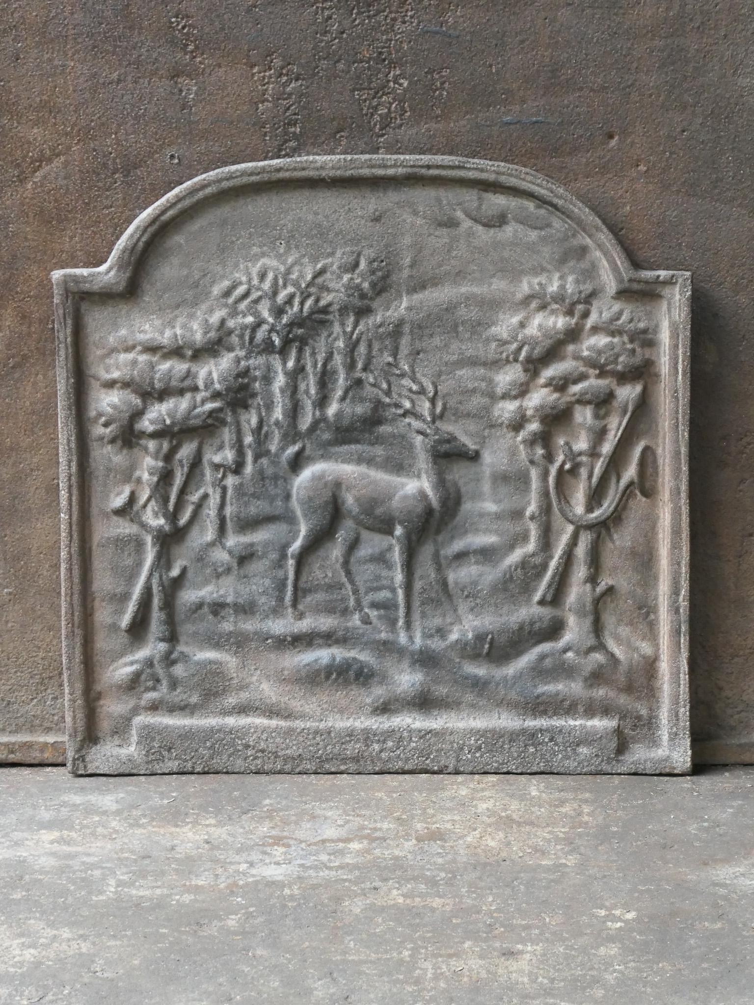 19th century French Napoleon III style fireback with a scene of a hunt at a court.

The fireback is made of cast iron and has a natural brown patina. Upon request it can be made black / pewter. The fireback is in a good condition and does not have