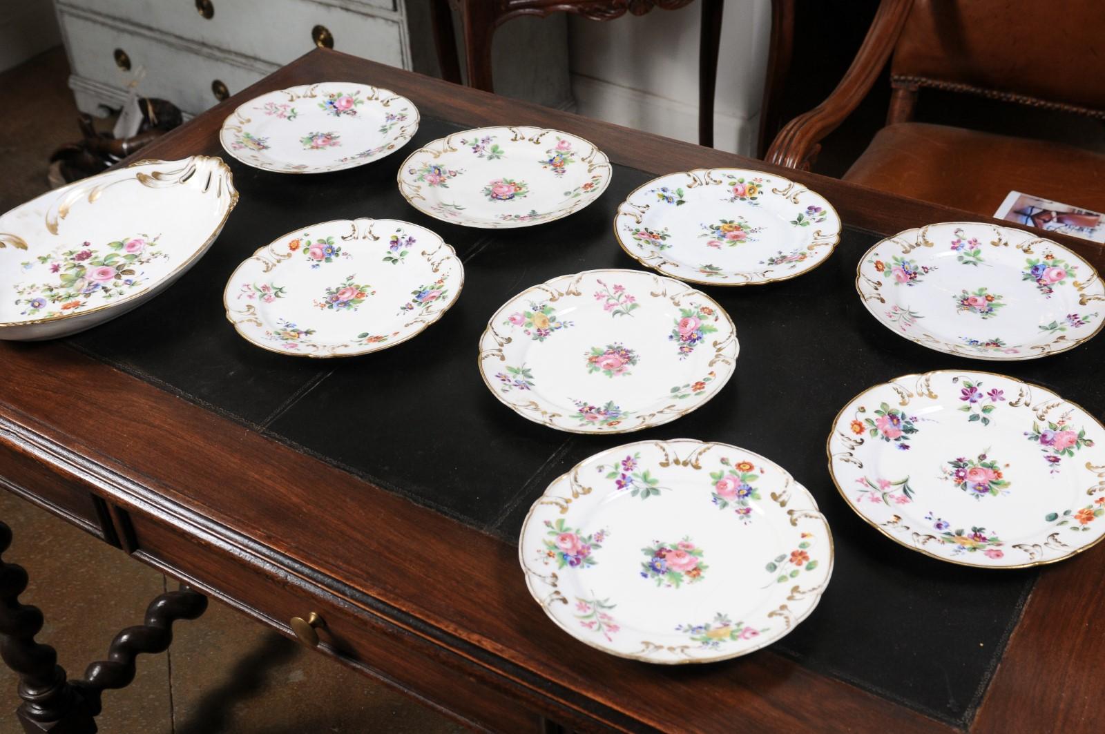 French Napoléon III period Porcelaine de Paris plates from the late 19th century, with floral décor. The plates are sold individually $145 each, the large platter is priced $225. Created in France during the third quarter of the 19th century at the