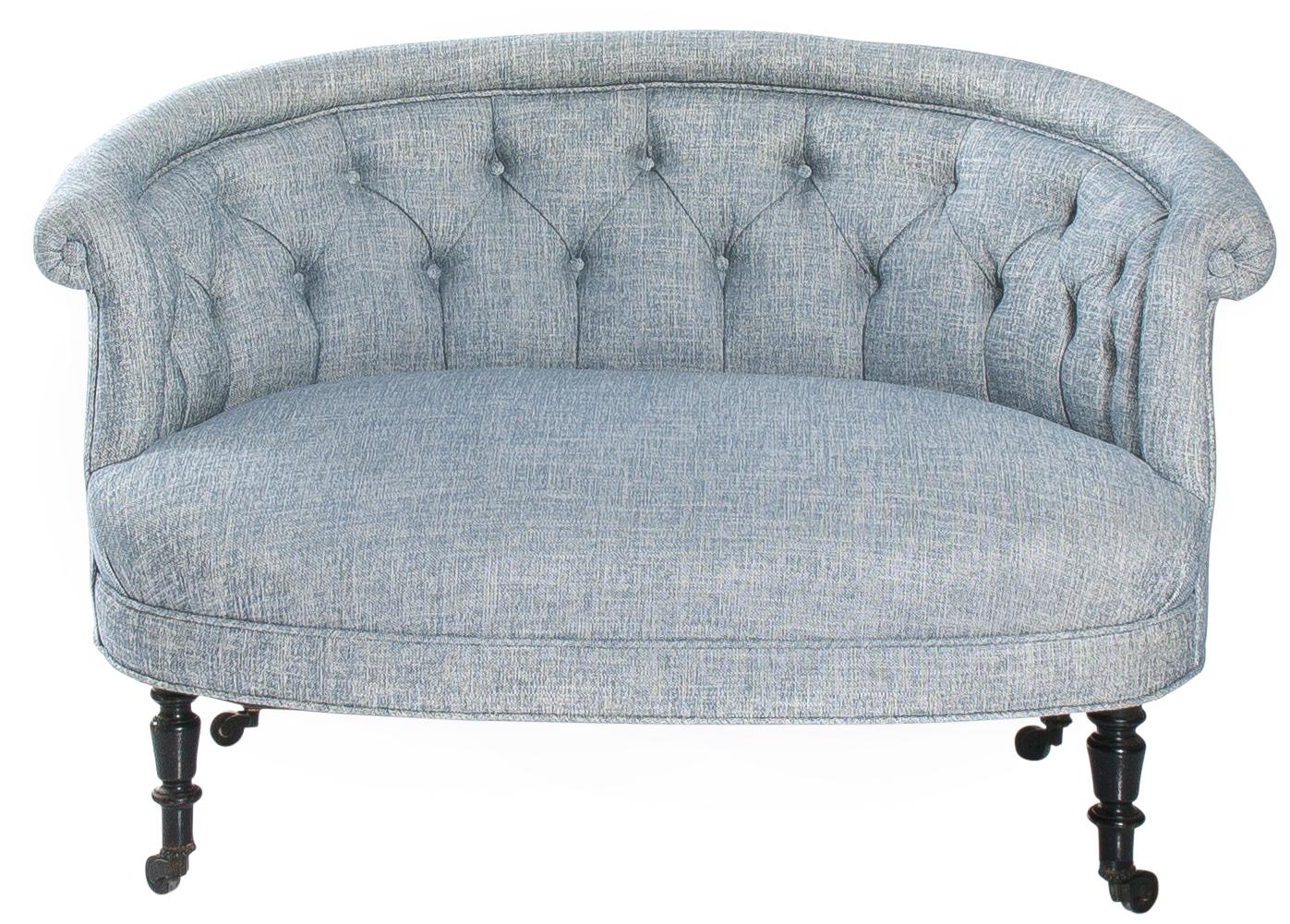 Petite French Napoleon III round scroll back sofa, circa 1880s. Turned black legs with original castors. Recently upholstered in Manuel Canovas 'Marius' in Ciel (light blue and white) linen.