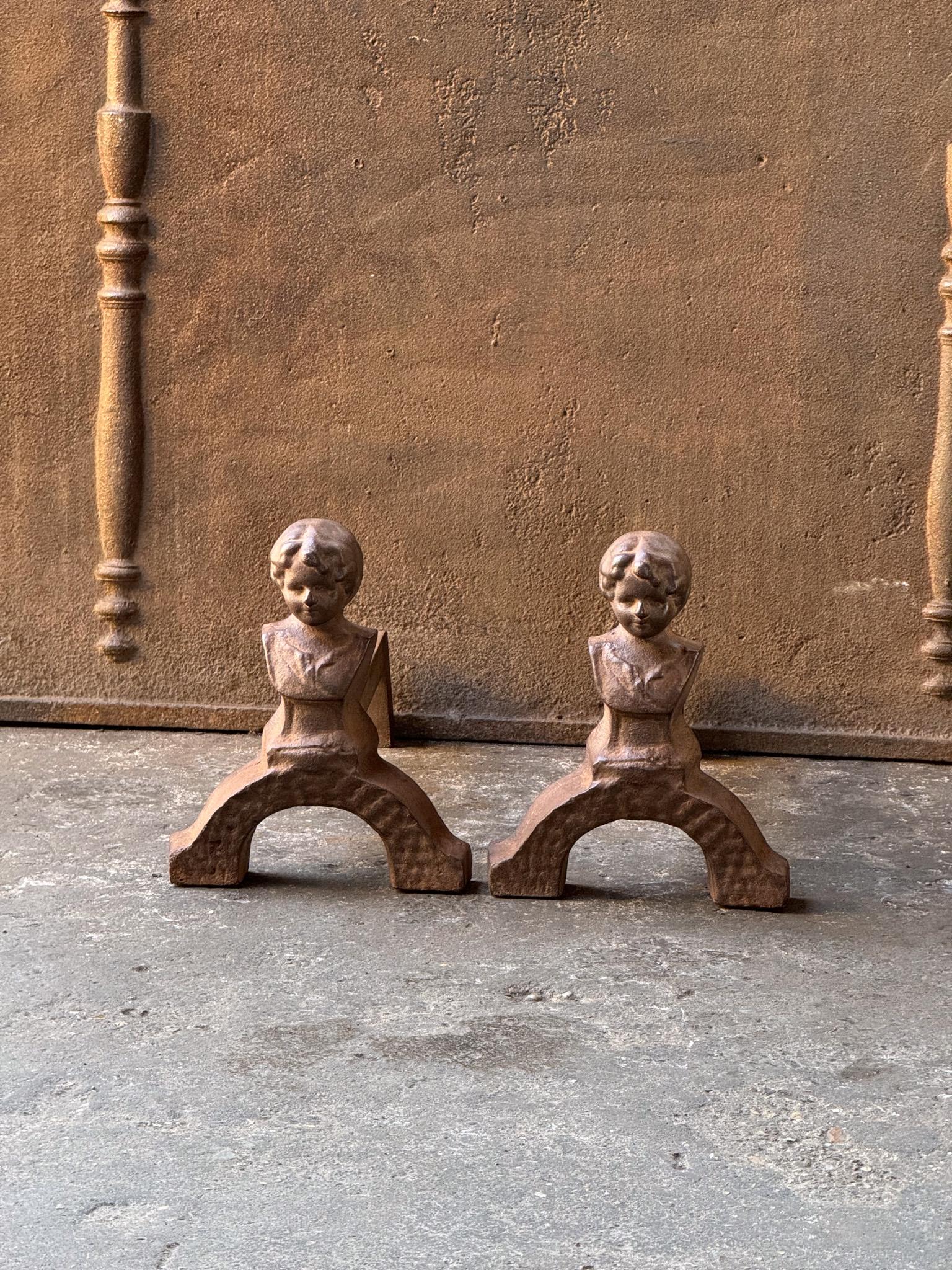 20th century French Napoleon III style andirons made of cast iron fronts and wrought iron beams. The andirons are in good condition.