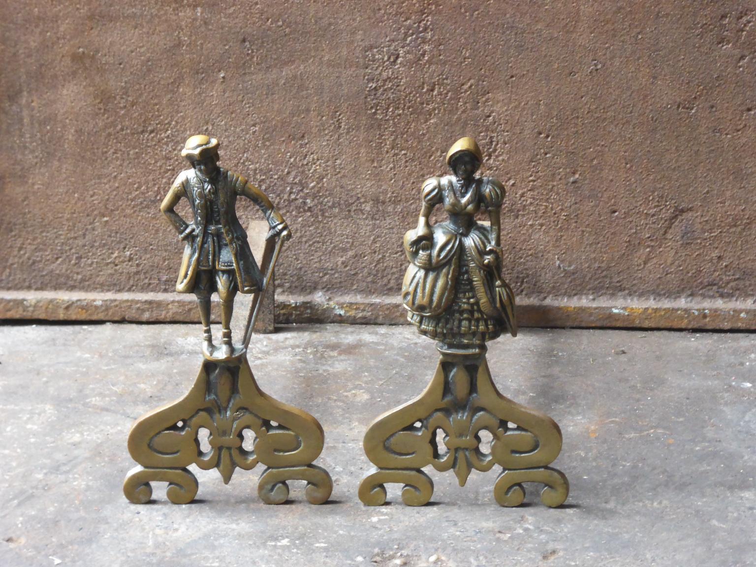 20th century French Napoleon III style andirons made of brass and wrought iron.