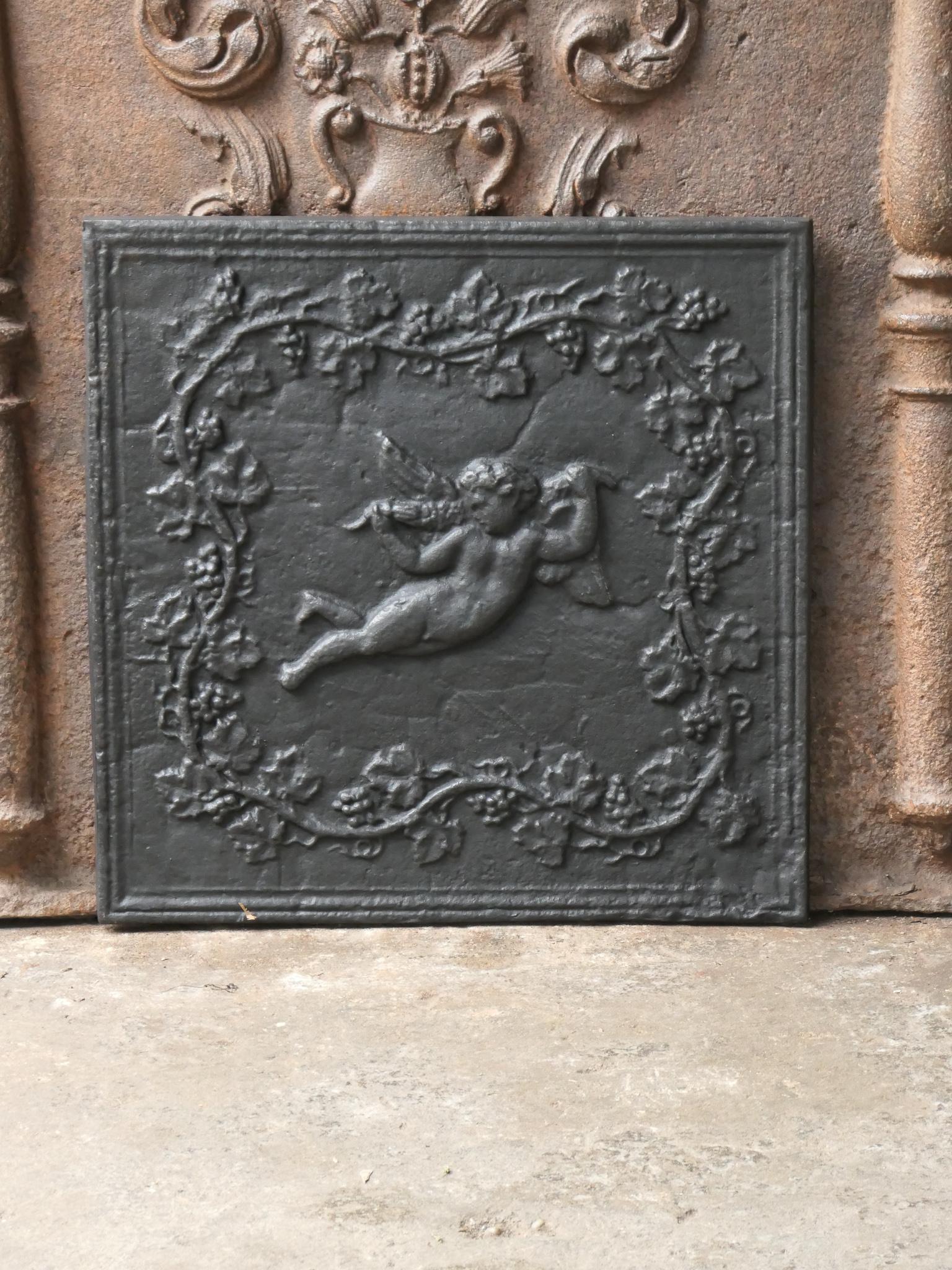 French Napoleon III style fireback with a cupid. The fireback is made of cast iron and has a black / pewter patina. The fireback is in a good condition and does not have cracks.







