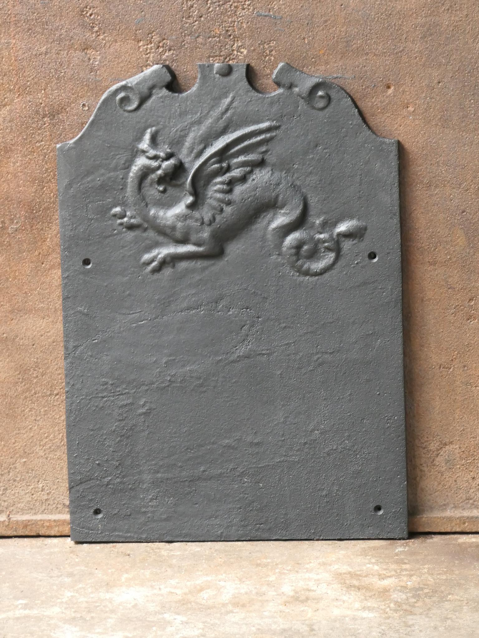 20th century French Napoleon III fireback with a dragon.

The fireback is made of cast iron and has a black / pewter patina. The fireback is in a good condition and does not have cracks.







