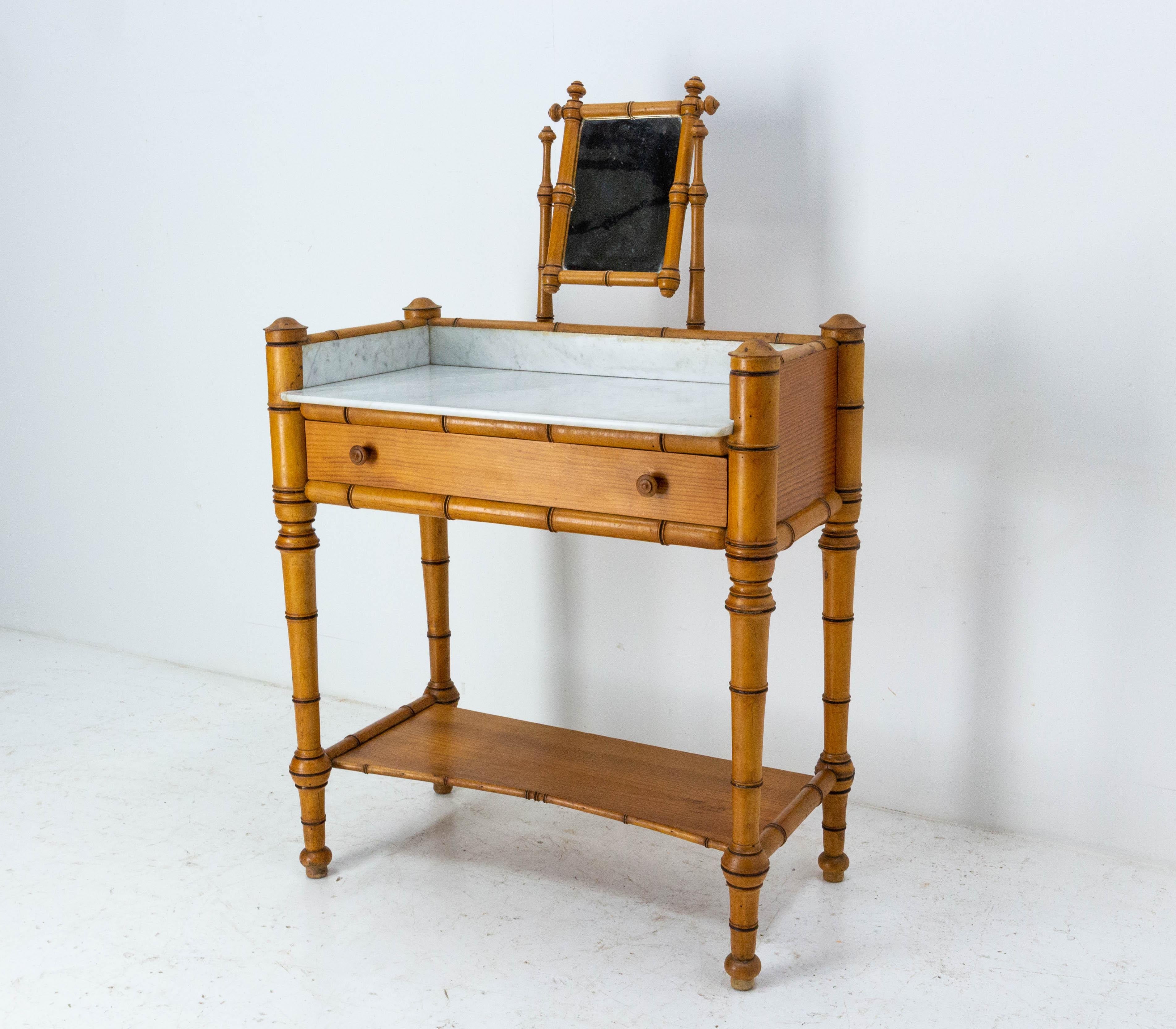 Vanity dressing table with central mirror, one drawer and one board, in the bamboo style
French early 20th century
Pine, linden wood, marble and mirror. 
All original

Dimensions:
Height of the table: 29.33 in. (74.5 cm)
Height between floor