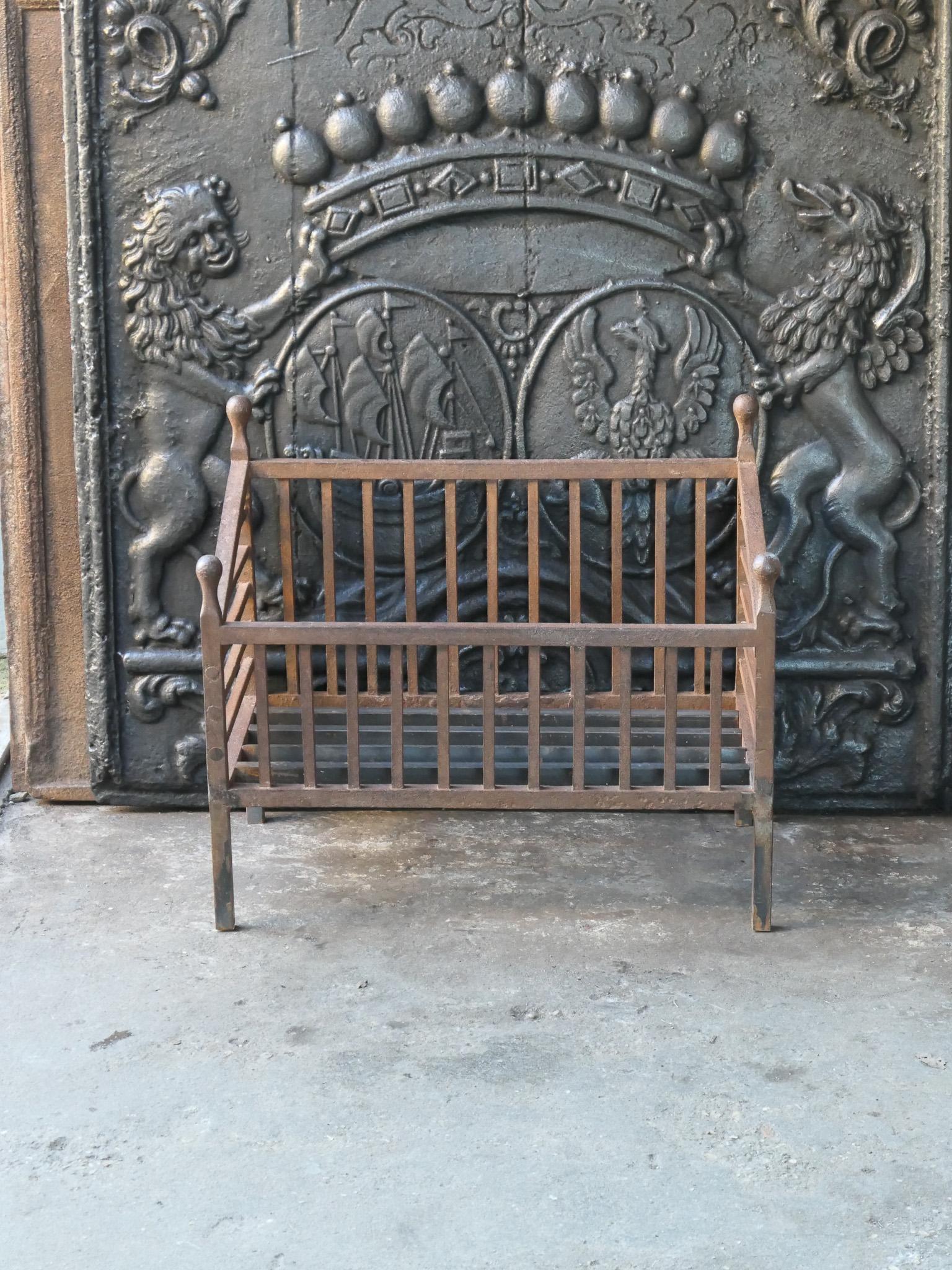 Late 19th or early 20th century French Napoleon III style fireplace grate. It is made of wrought iron. The basket is in a good condition and is fully functional.
