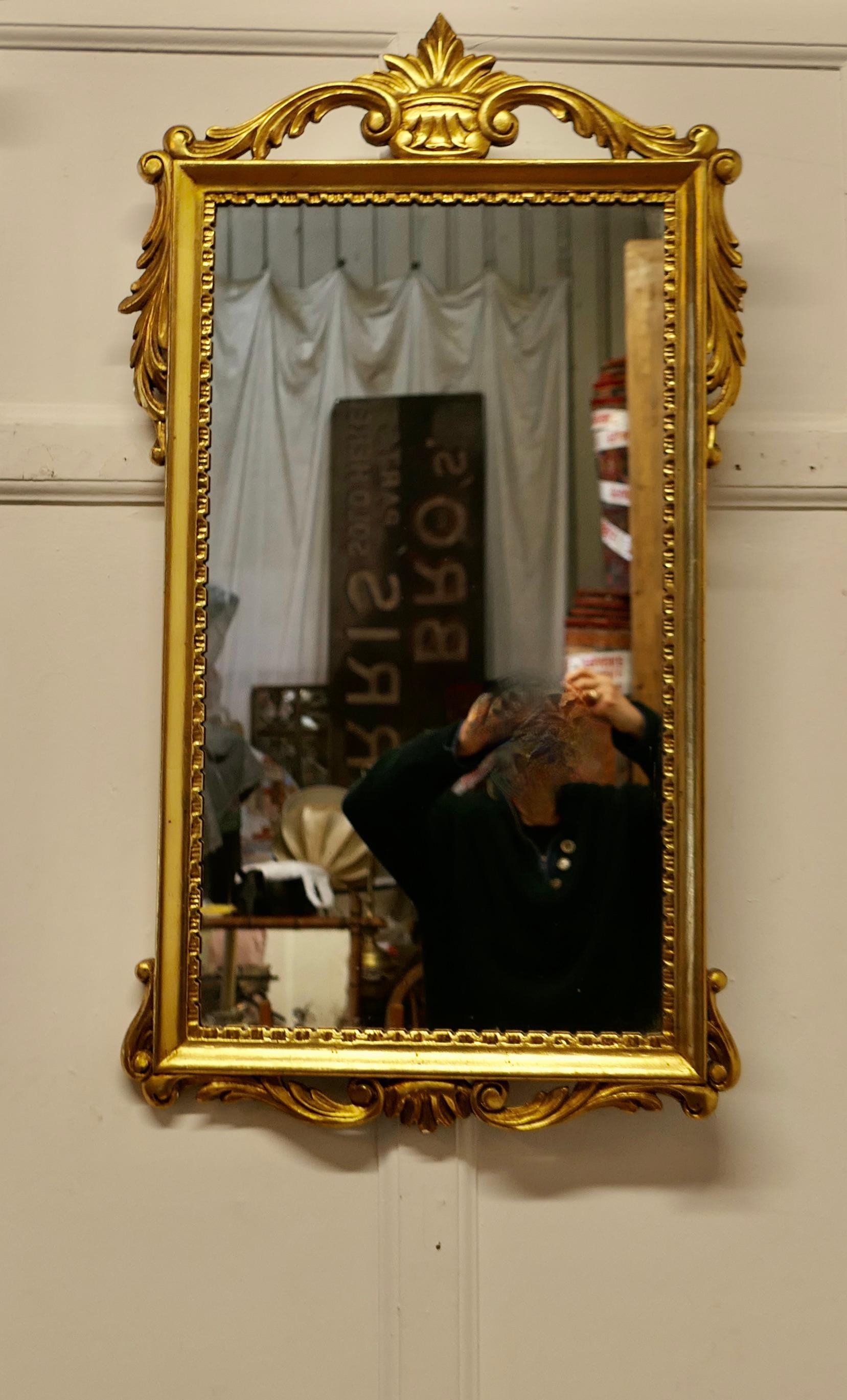 French Napoleon III Style Gilt Wall Mirror, Crown Crest 

This is a very attractive piece, the mirror has a 3.5” gilt frame edged with swags and a crown in the centre at the top of the mirror 
The Mirror is 38” high and 21” wide and 1” deep
FB82