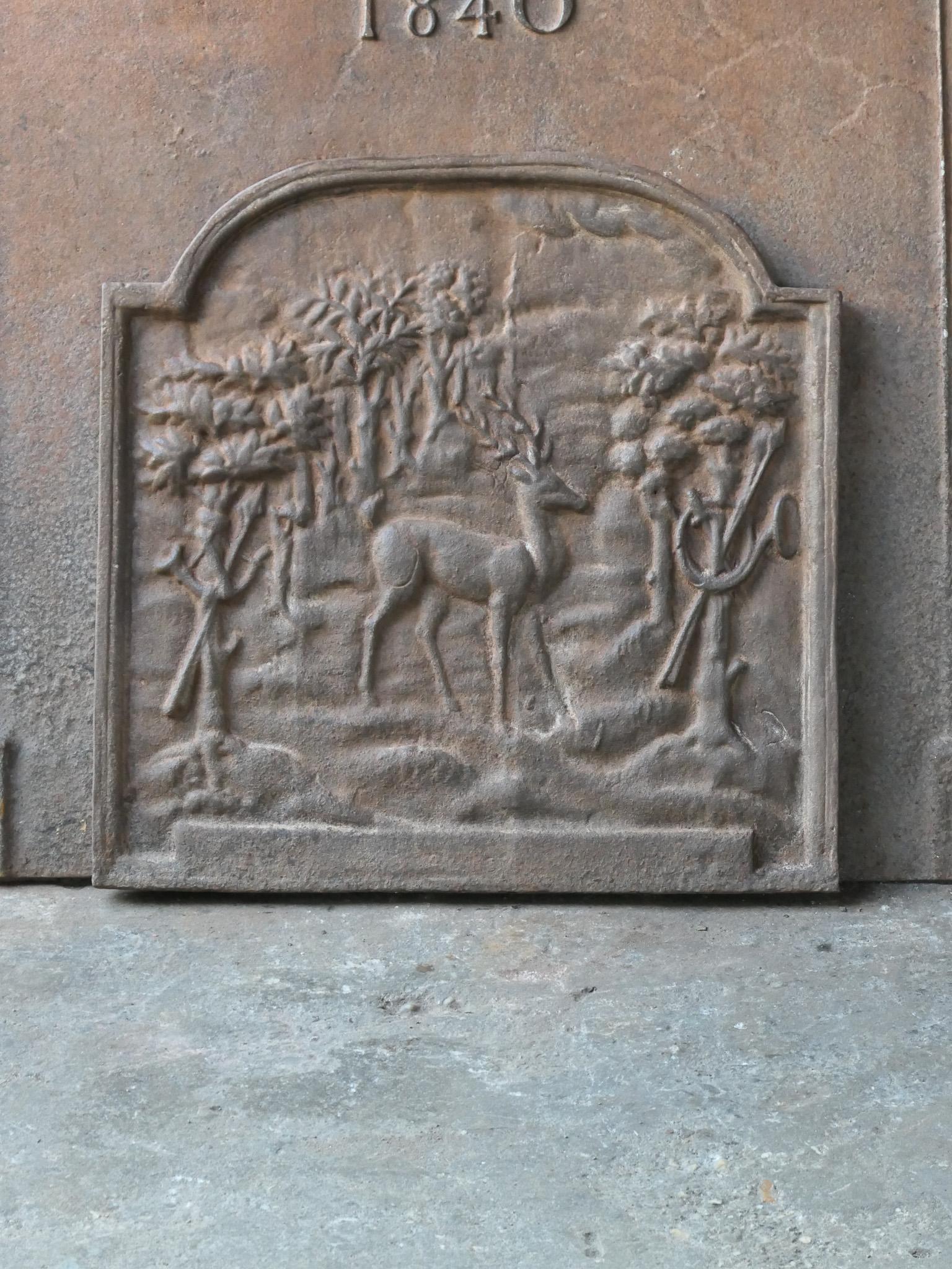 20th century French Napoleon III style fireback with a scene of a hunt at a court.

The fireback is made of cast iron and has a natural brown patina. Upon request it can be made black / pewter. The fireback is in a good condition and does not have