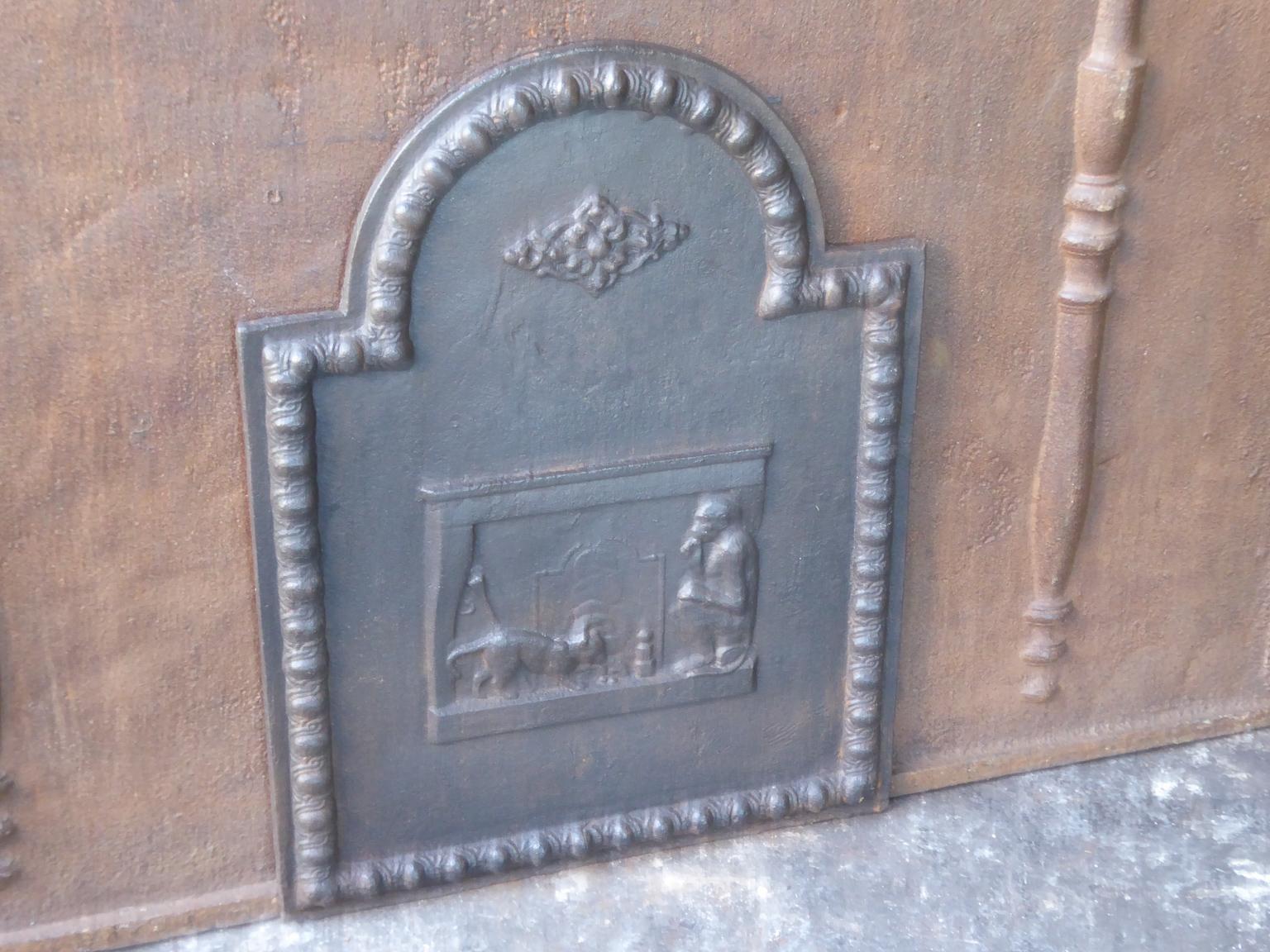 20th century French Napoleon III style fireback with a rural scene. The fireback is made of cast iron. The patina is natural brown. Upon request it can be made black.