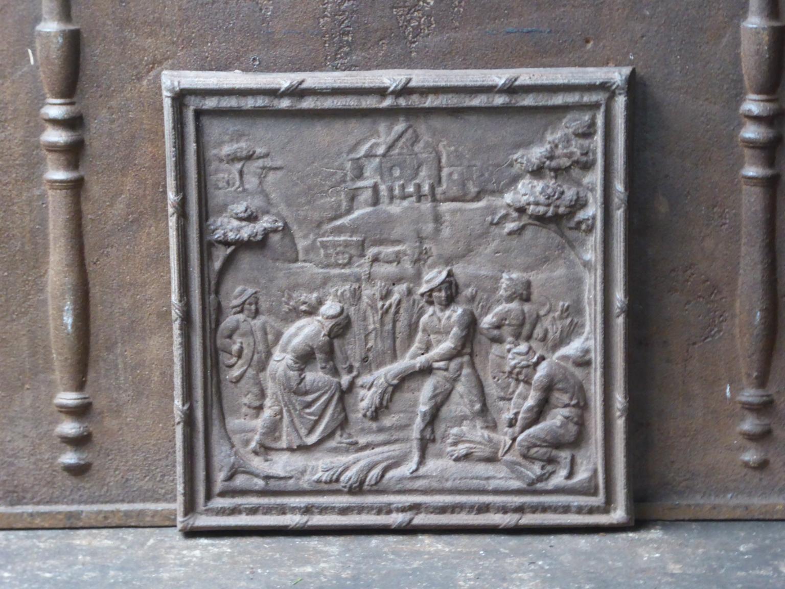 20th century French Napoleon III style fire back with a rural scene.

The fire back is made of cast iron and has a natural brown patina. Upon request it can be made black / pewter. The fire back is in a good condition and does not have