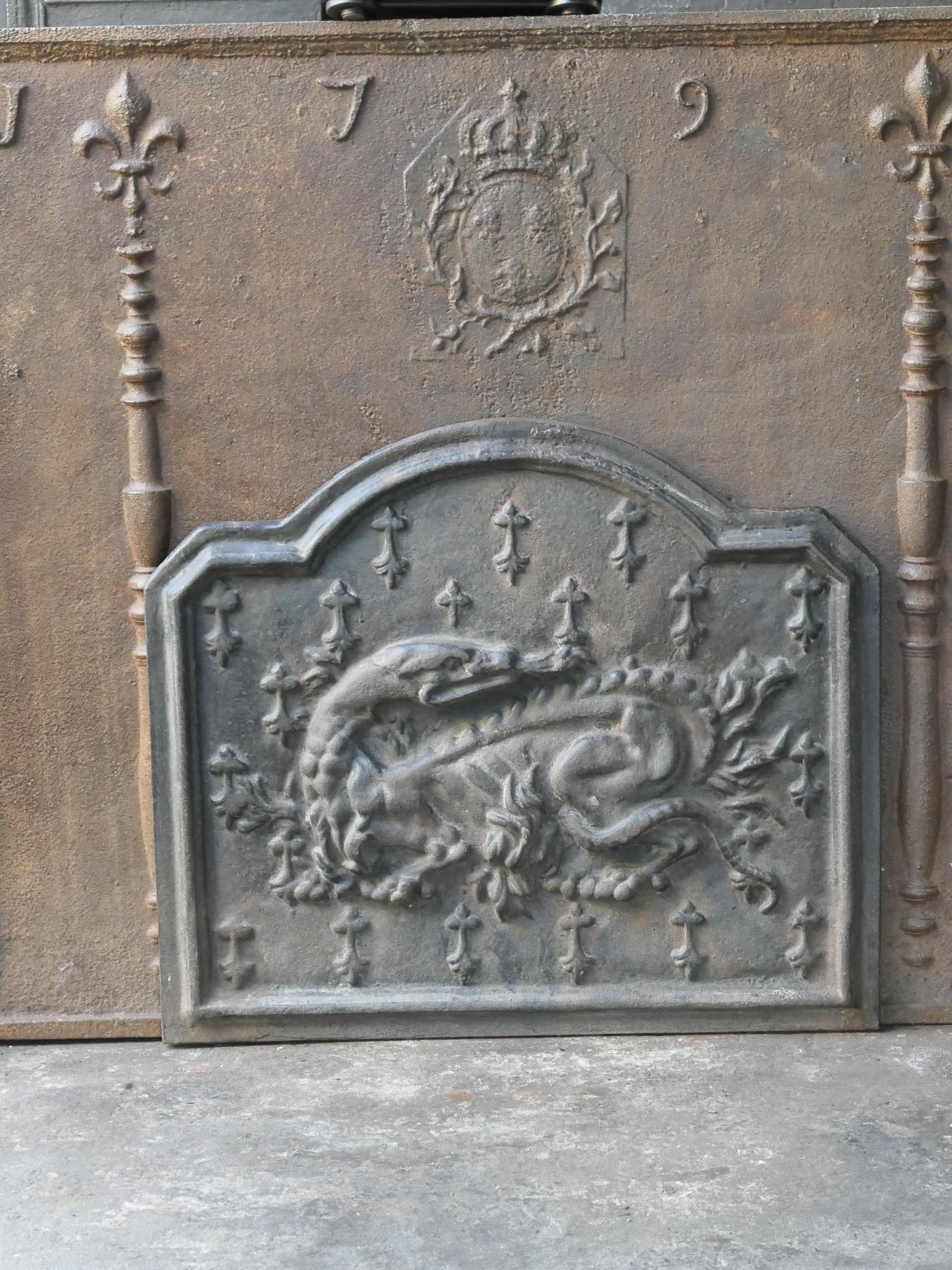 20th century French Napoleon III style fireback with the salamander. The salamander is symbol of King François I, who was King of France from 1515 till 1547.

The fireback is made of cast iron and has a natural brown patina. Upon request it can be